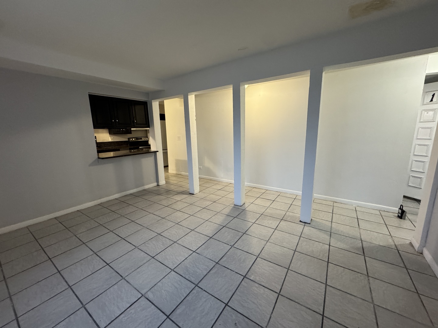 1751 Felten Road, Unit 1 Aurora, IL 60505 - Photo 4 of 11 a view of an empty room and window