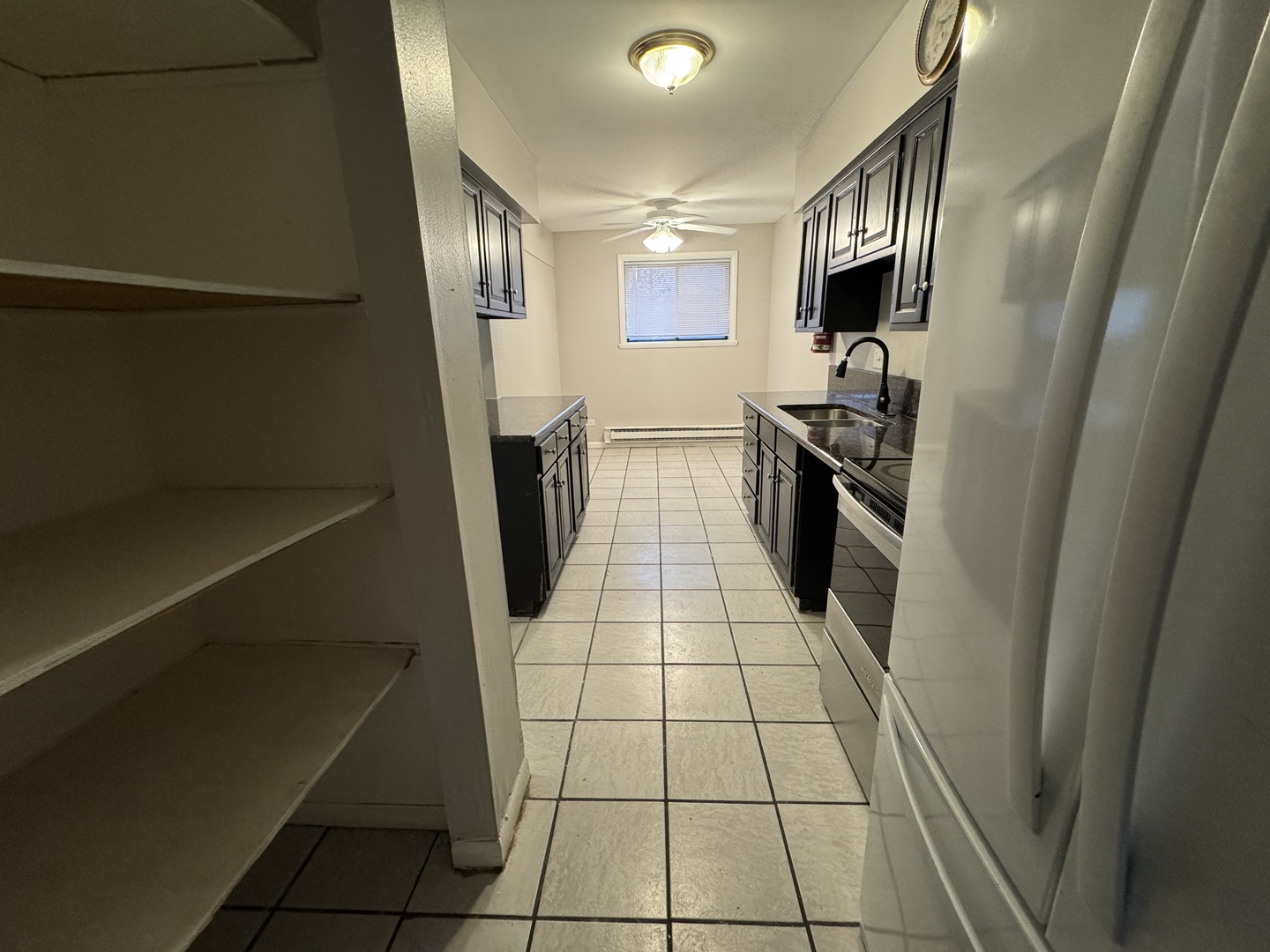 1751 Felten Road, Unit 1 Aurora, IL 60505 - Photo 6 of 11 a kitchen with stainless steel appliances a refrigerator sink and stove