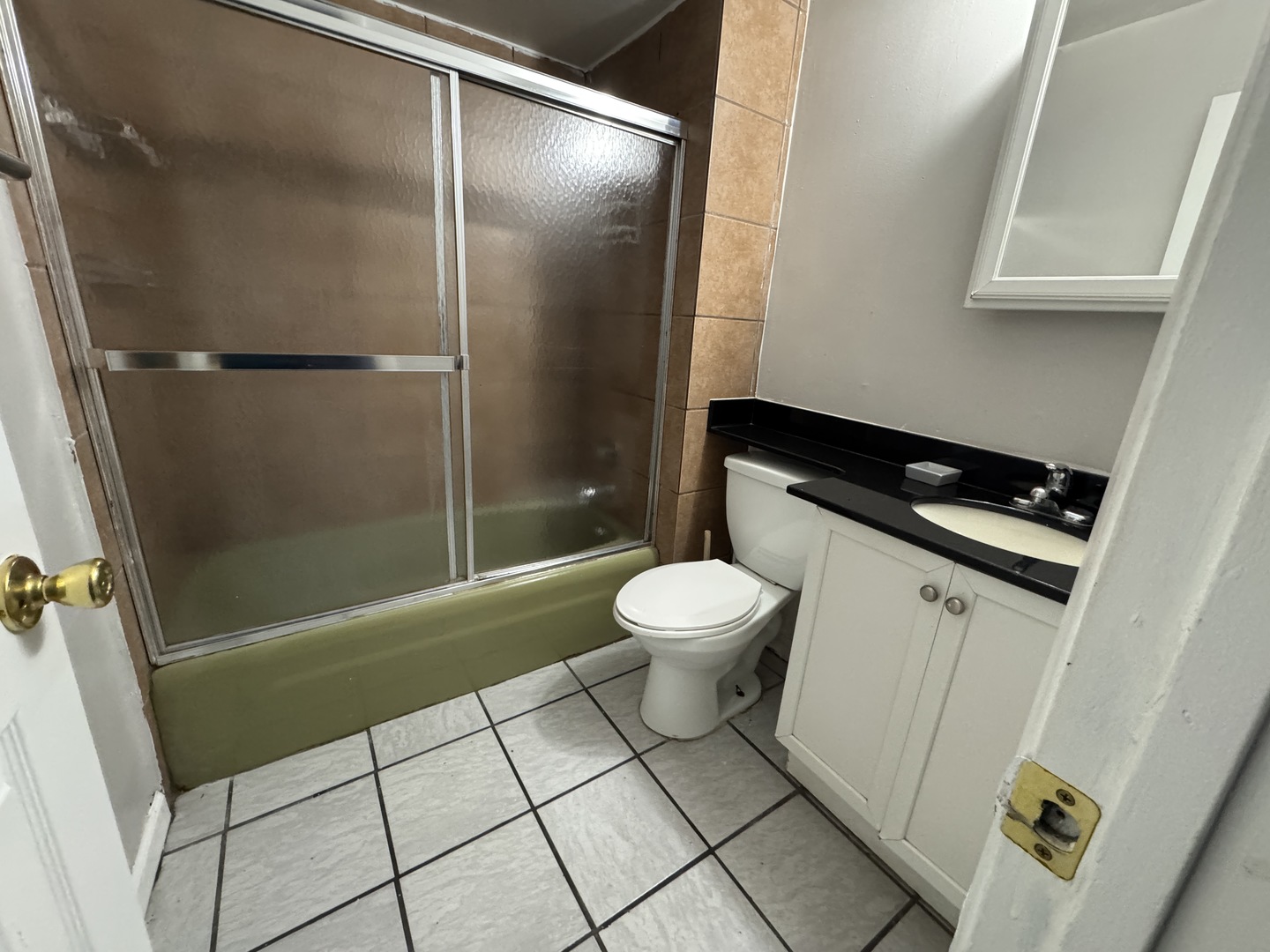 1751 Felten Road, Unit 1 Aurora, IL 60505 - Photo 7 of 11 a bathroom with a toilet and a shower