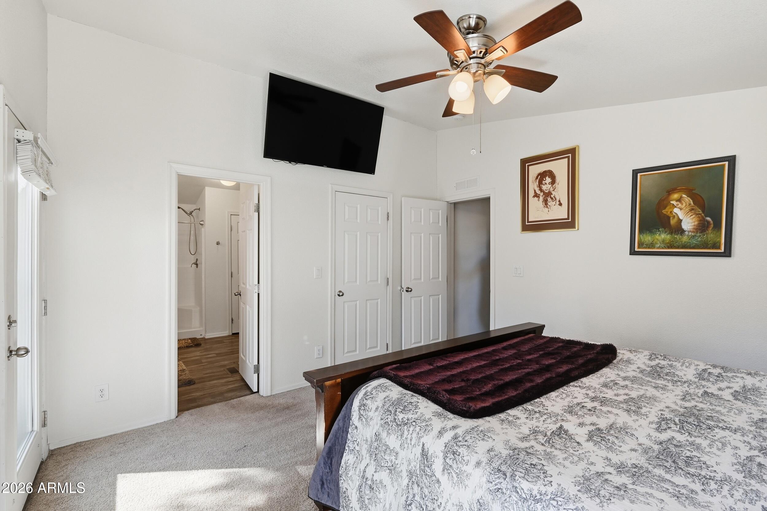 206 East Pine Street Payson, AZ 85541 - Photo 12 of 30 a bedroom with a bed and a flat screen tv