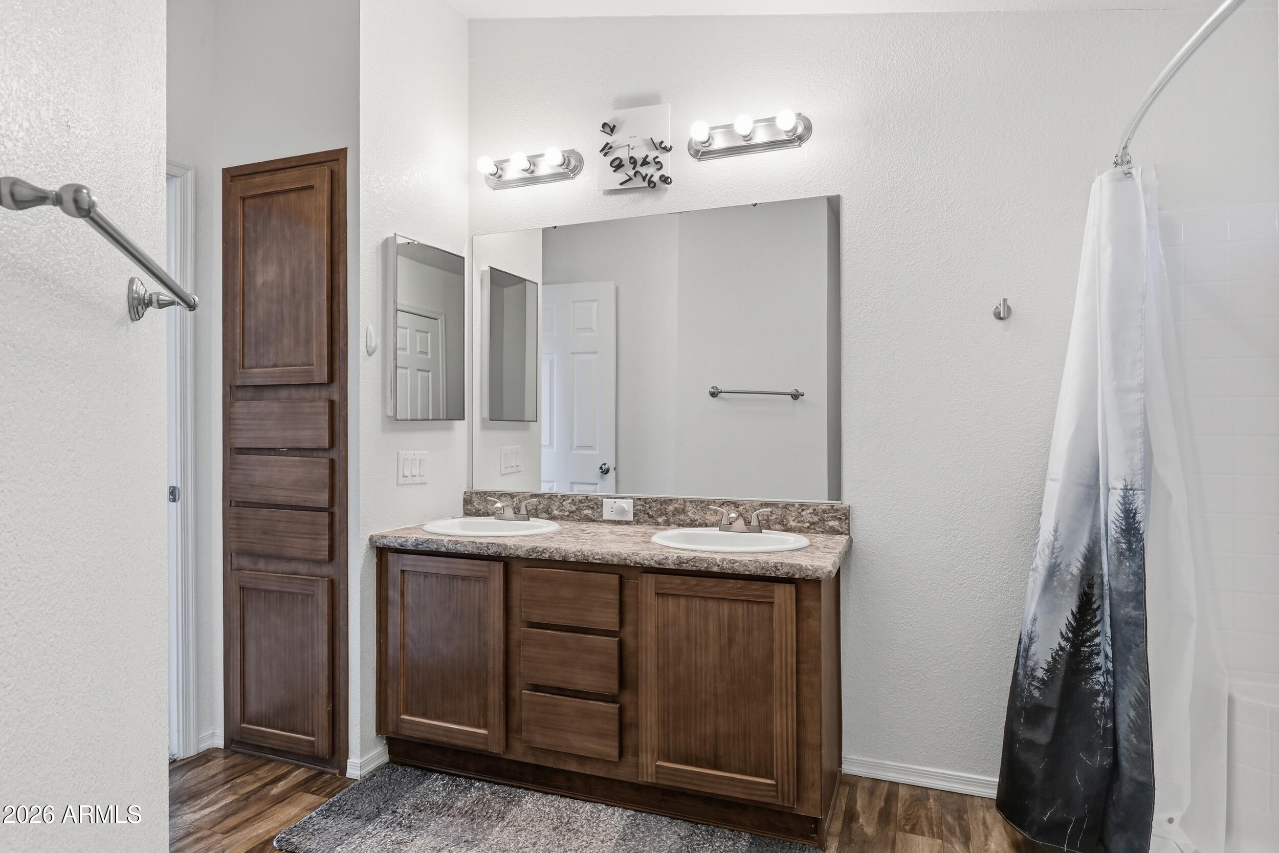 206 East Pine Street Payson, AZ 85541 - Photo 14 of 30 a bathroom with a sink and a mirror