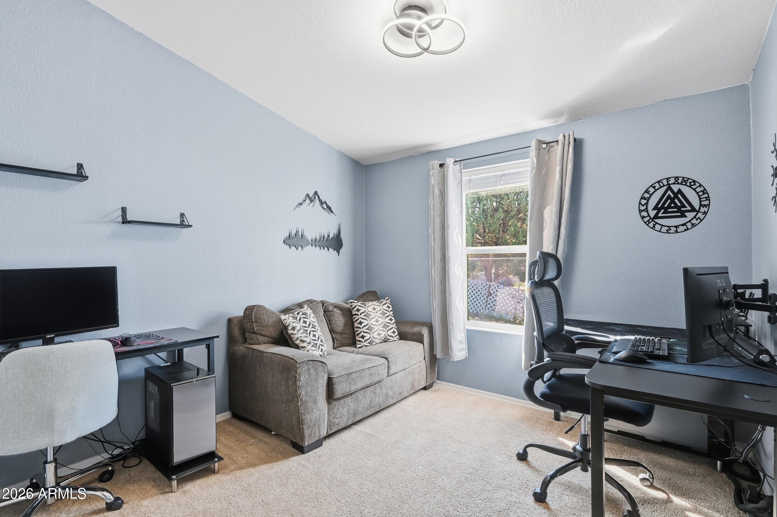 206 East Pine Street Payson, AZ 85541 - Photo 15 of 30 a livingroom with workspace and a couch