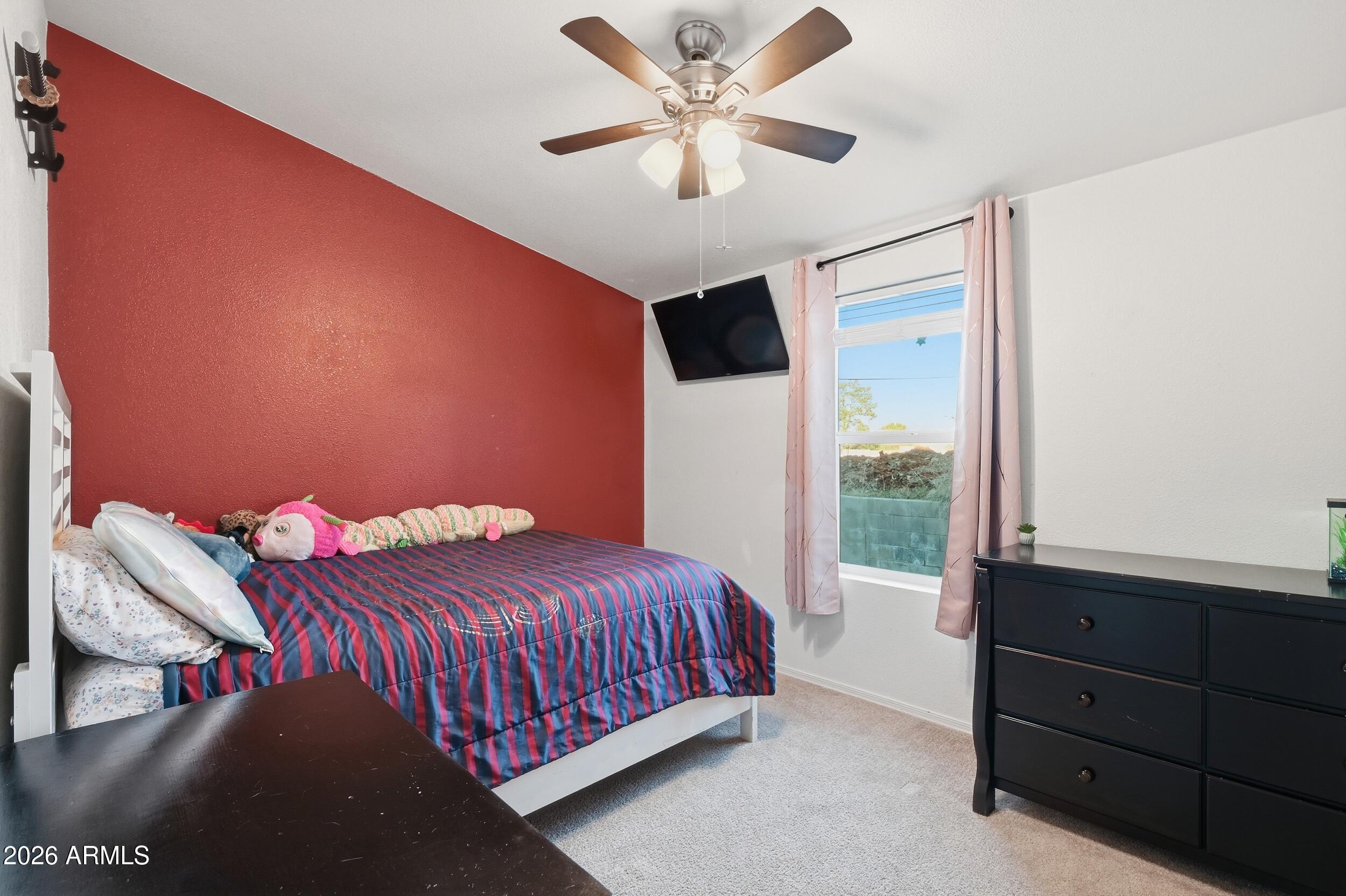 206 East Pine Street Payson, AZ 85541 - Photo 16 of 30 a bedroom with a bed and a window