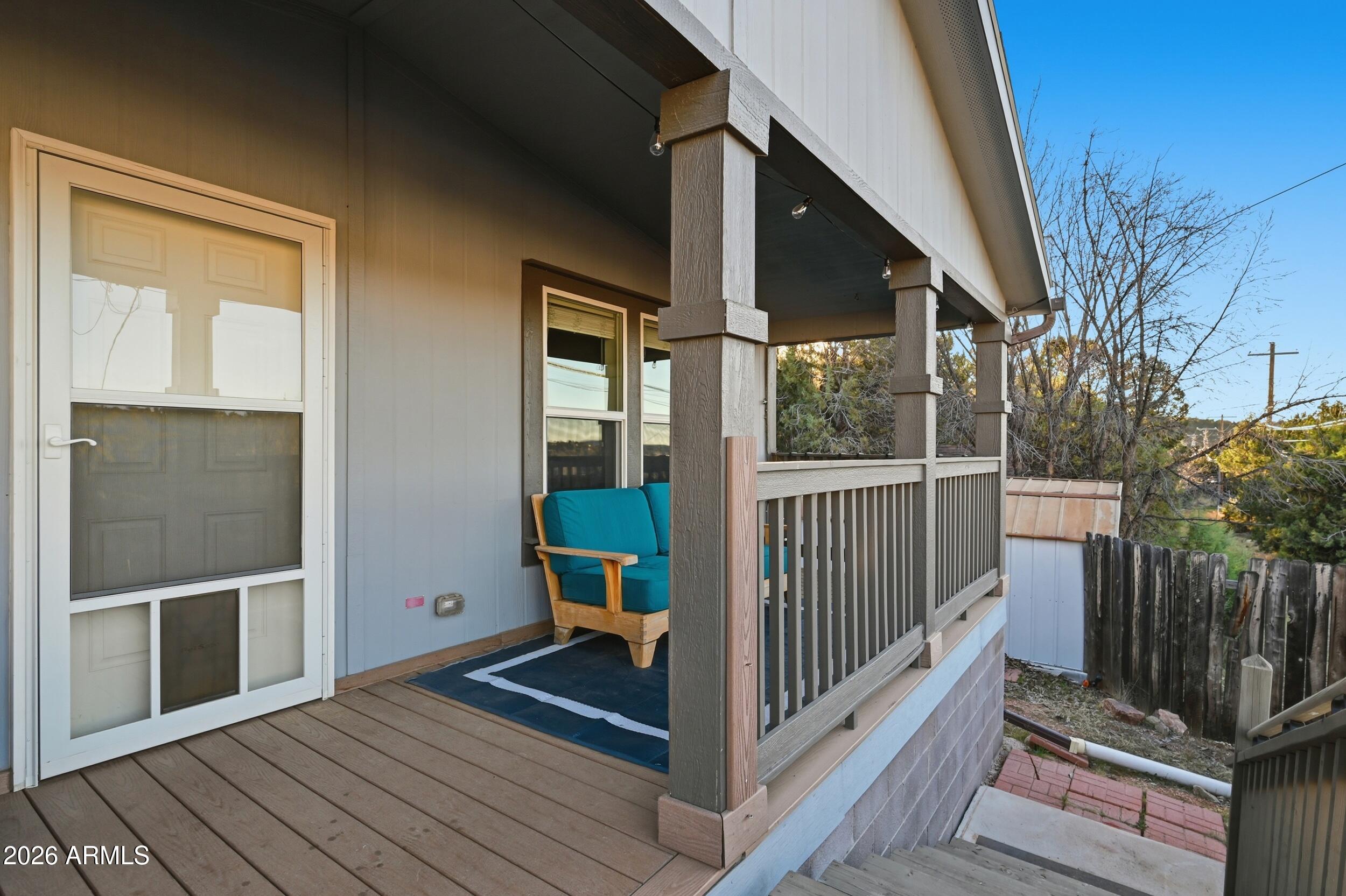 206 East Pine Street Payson, AZ 85541 - Photo 23 of 30 a view of a balcony with wooden floor and fence