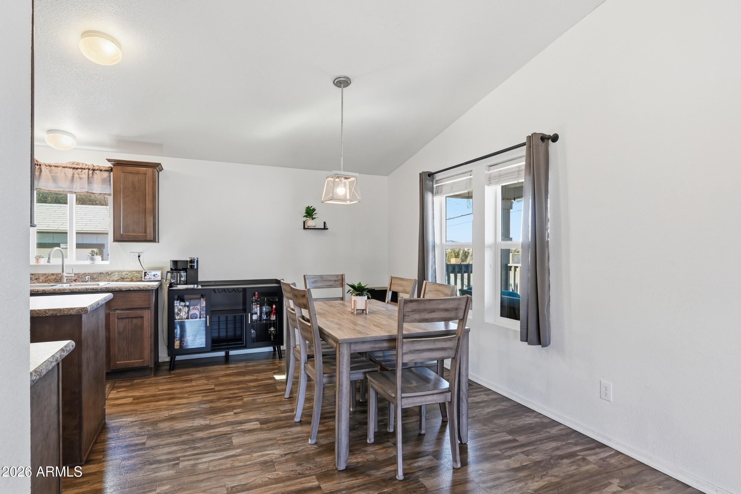 206 East Pine Street Payson, AZ 85541 - Photo 6 of 30 a view of a dining room with furniture window and wooden floor