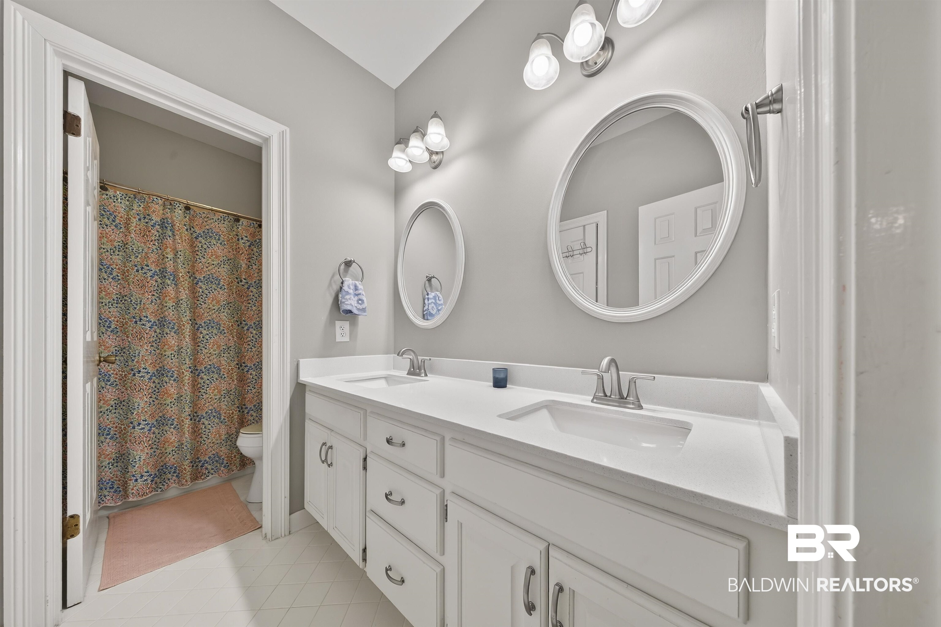 1250 Savannah Drive Mobile, AL 36609 - Photo 23 of 35 Full bath featuring double vanity, a shower with curtain, and light tile patterned flooring