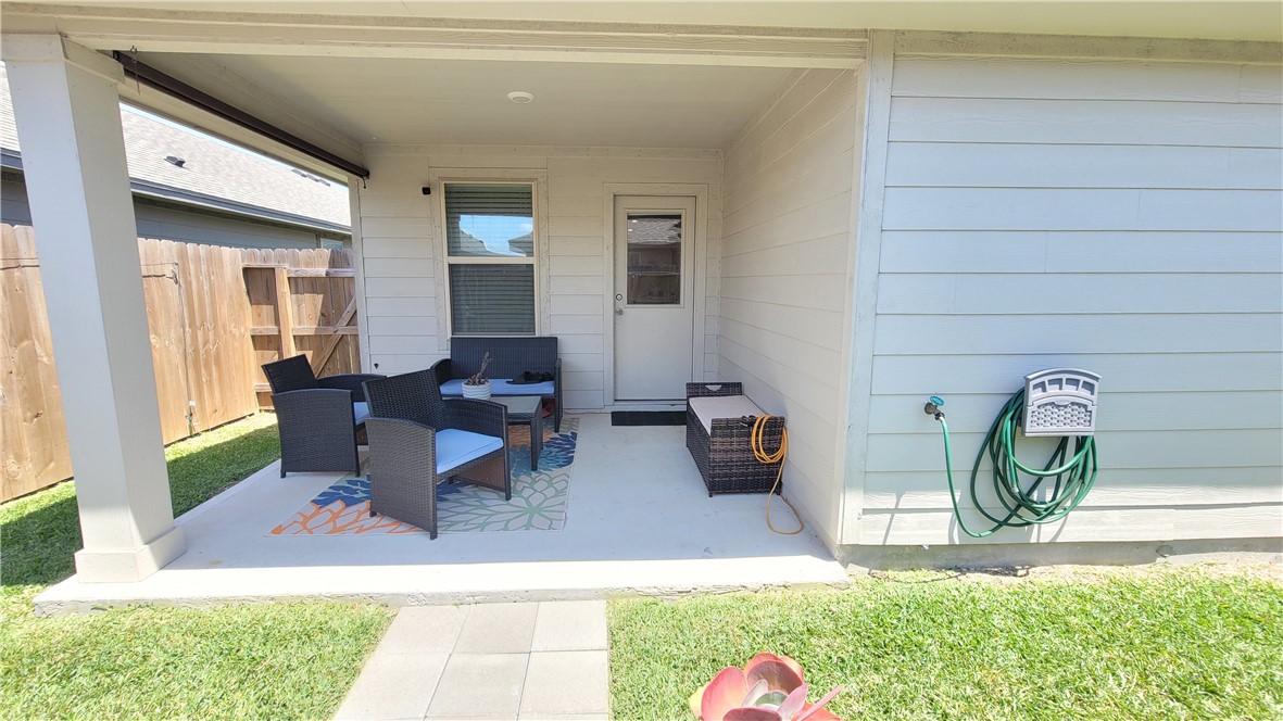 7633 Shadow Rider Lane Corpus Christi, TX 78414 - Photo 21 of 23 a living room with furniture and a table