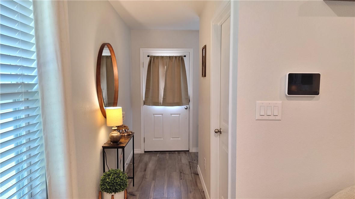 7633 Shadow Rider Lane Corpus Christi, TX 78414 - Photo 5 of 23 a view of a bedroom with a furniture and a mirror
