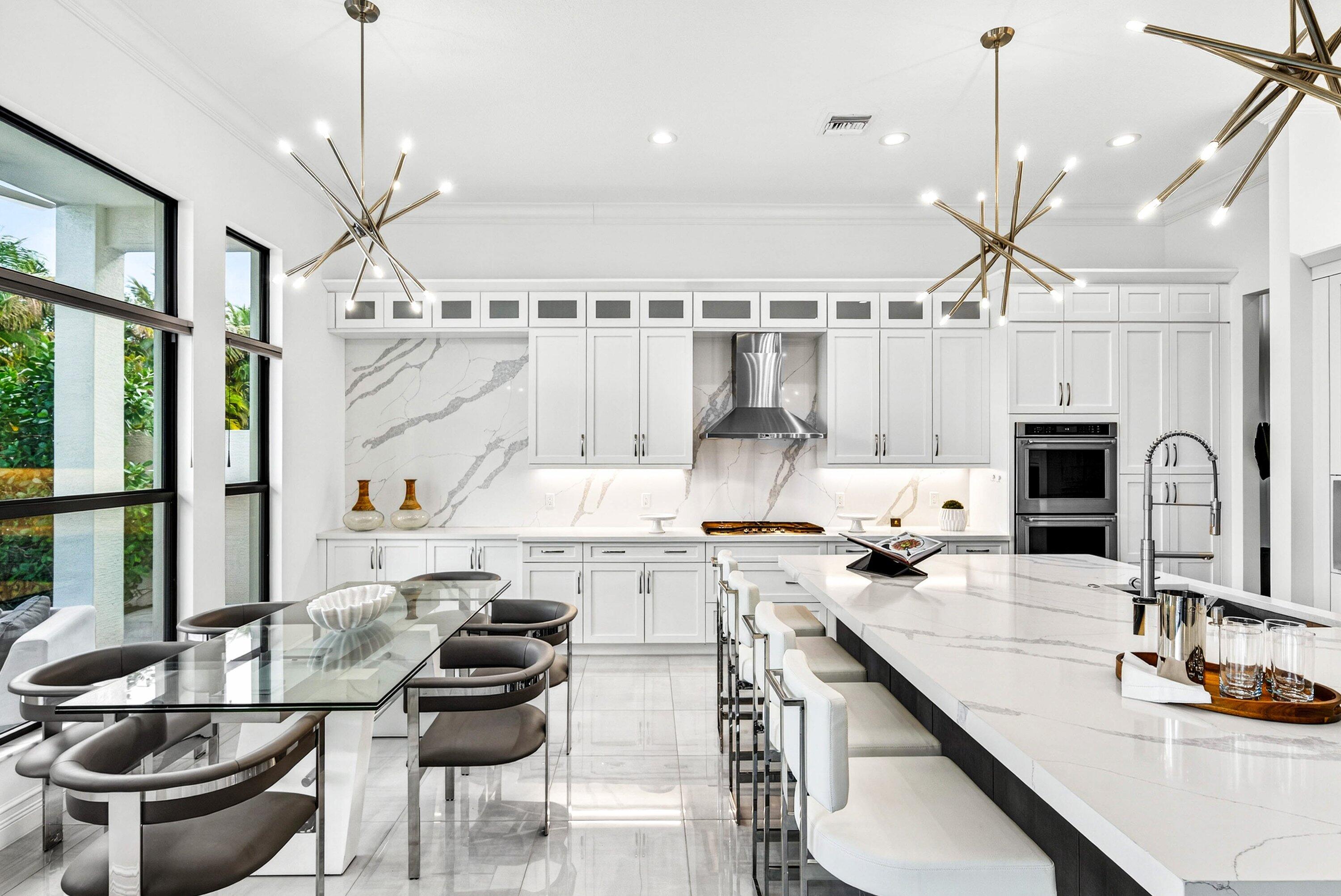 9065 Benedetta Place Boca Raton, FL 33496 - Photo 12 of 51 a kitchen with a stove a sink and a refrigerator