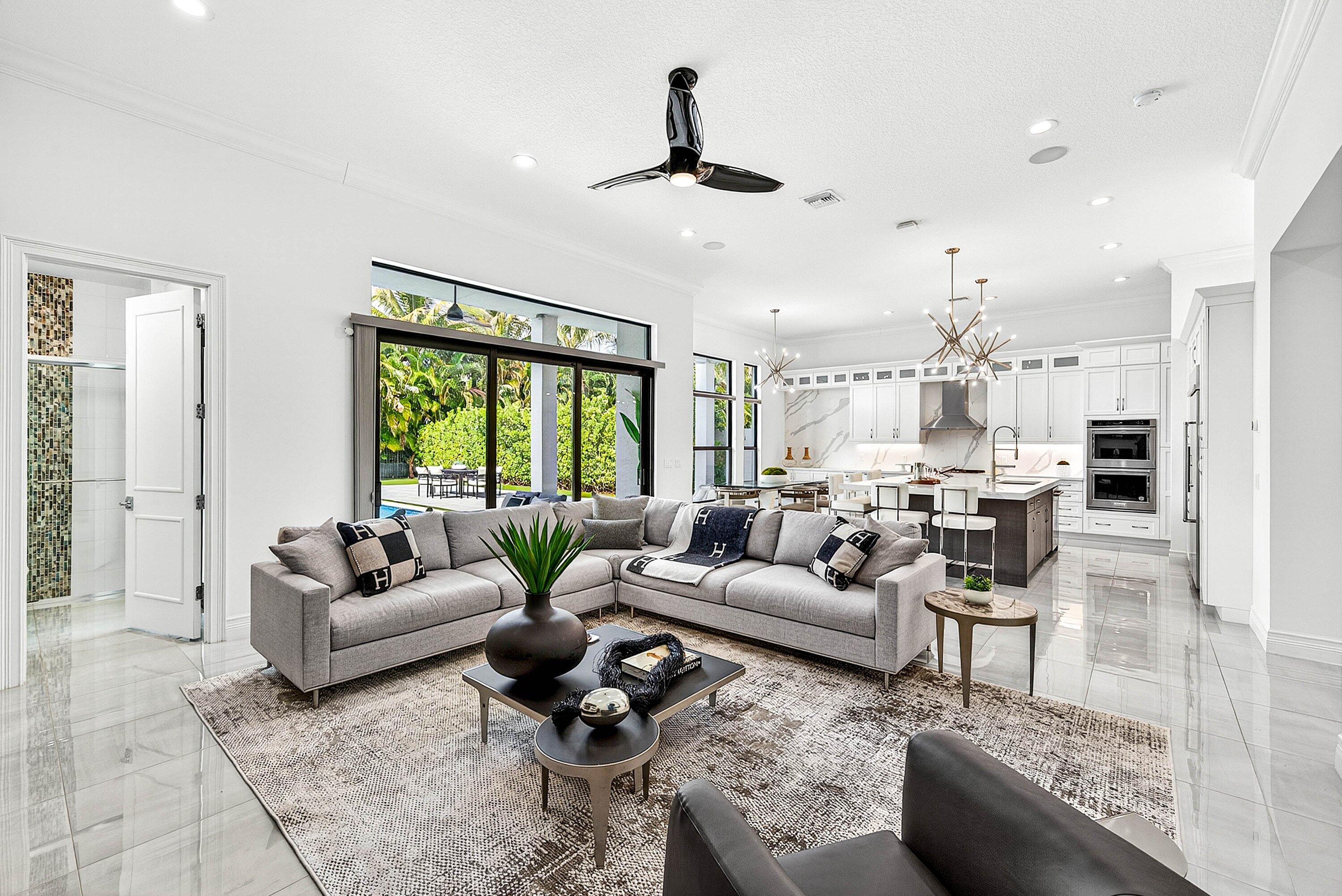 9065 Benedetta Place Boca Raton, FL 33496 - Photo 12 of 52 a living room with furniture and a large window