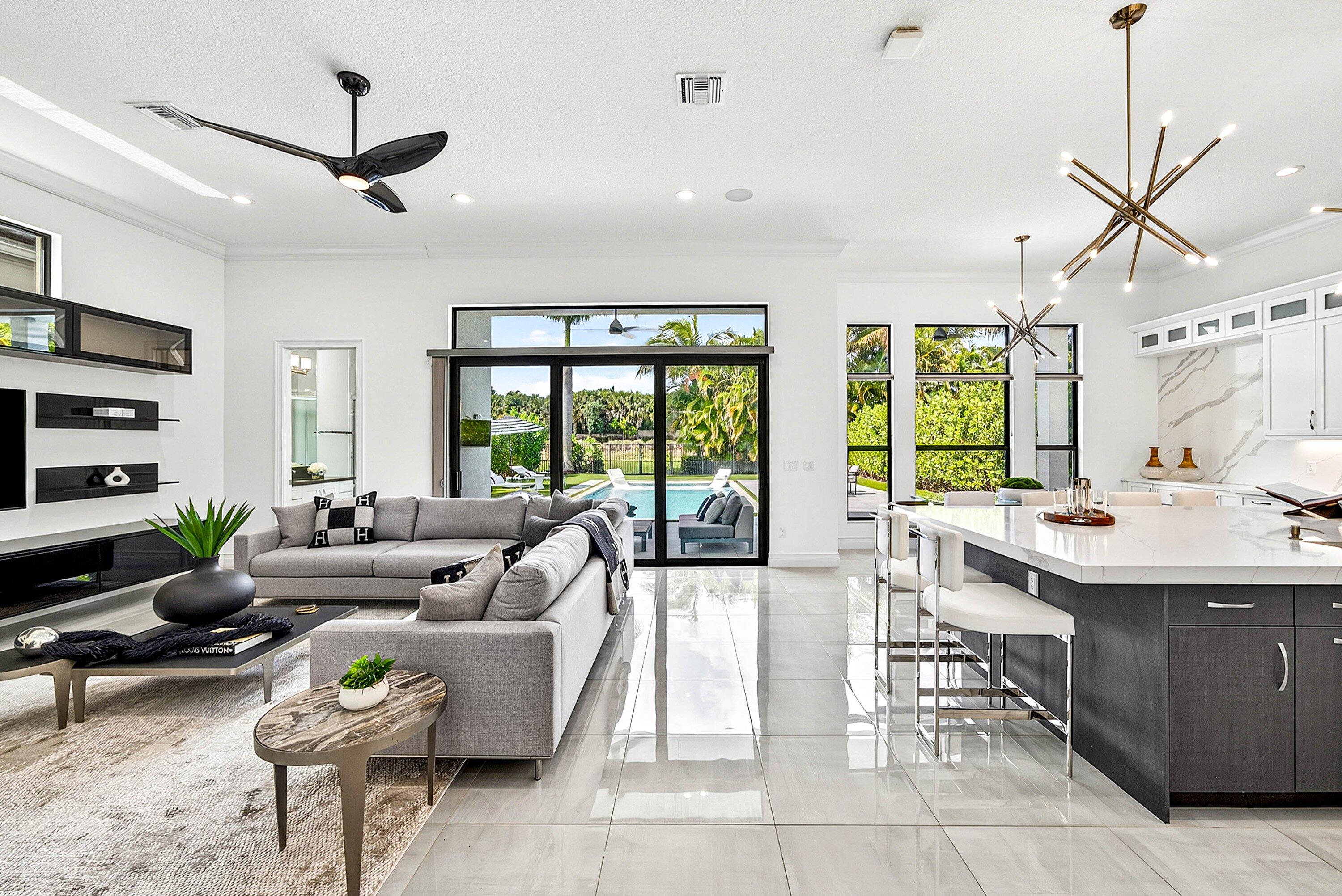 9065 Benedetta Place Boca Raton, FL 33496 - Photo 14 of 52 a living room with furniture and a large window