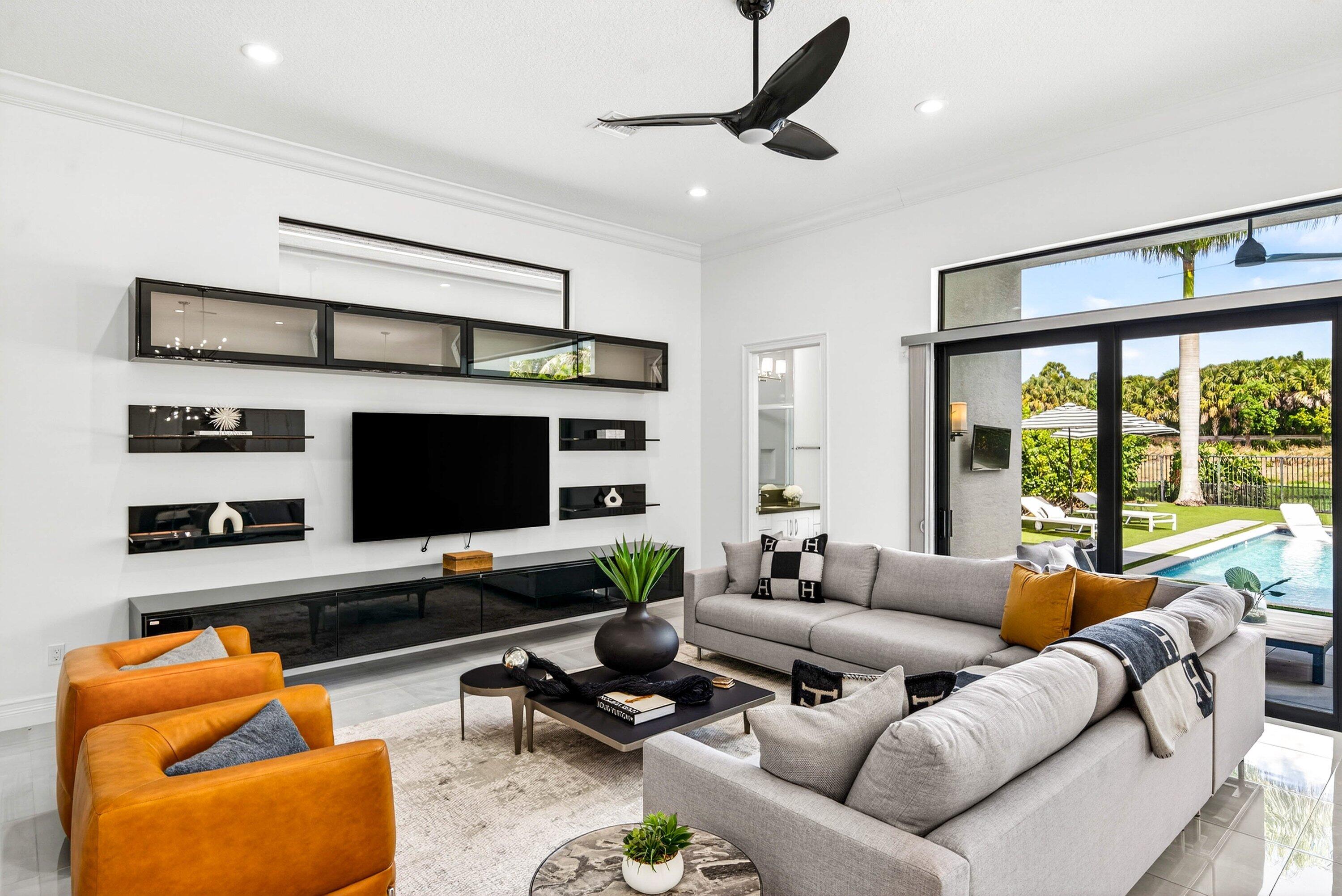 9065 Benedetta Place Boca Raton, FL 33496 - Photo 14 of 51 a living room with furniture and a flat screen tv