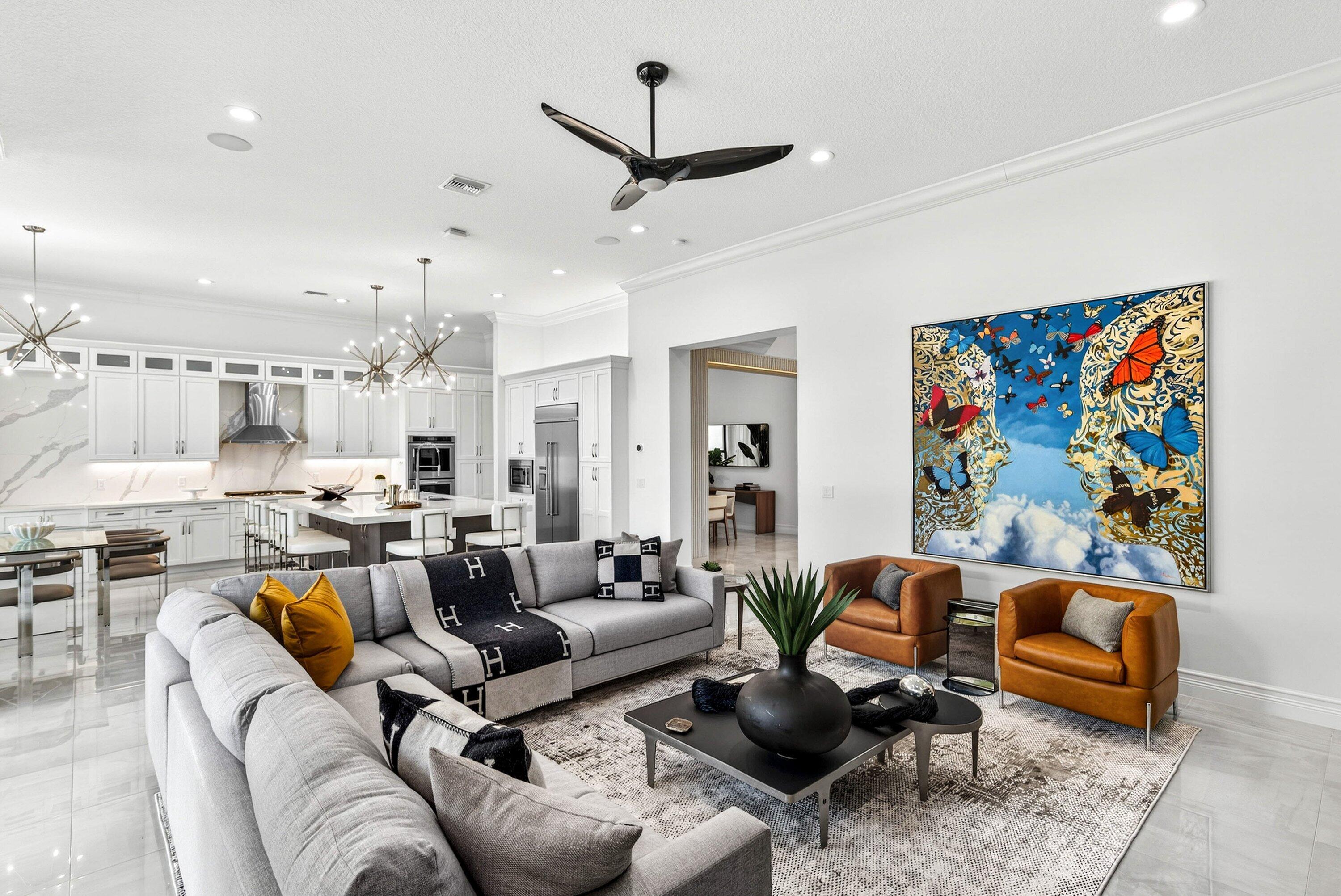 9065 Benedetta Place Boca Raton, FL 33496 - Photo 15 of 51 a living room with furniture kitchen view and a chandelier