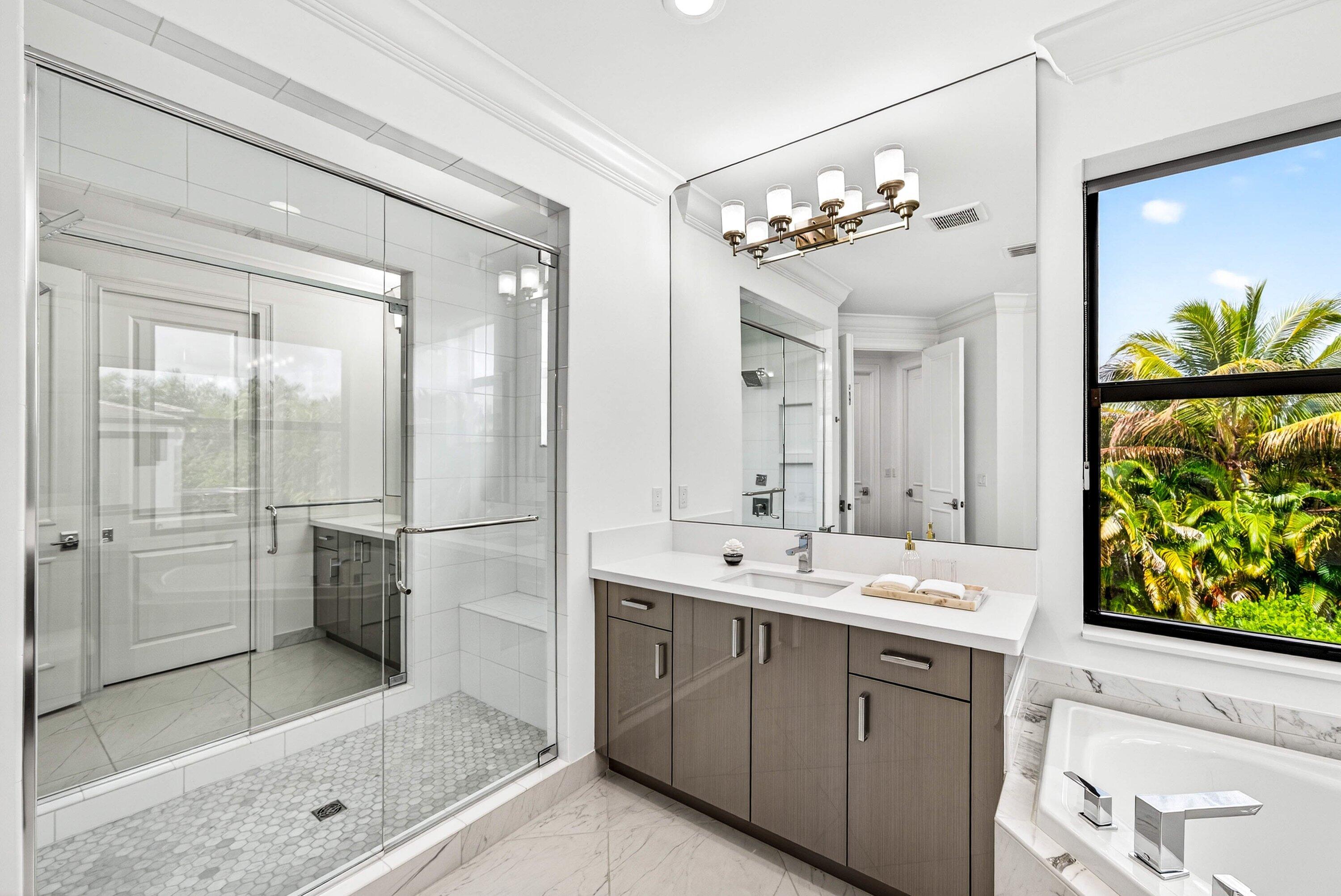 9065 Benedetta Place Boca Raton, FL 33496 - Photo 20 of 51 a bathroom with a double vanity sink mirror and shower