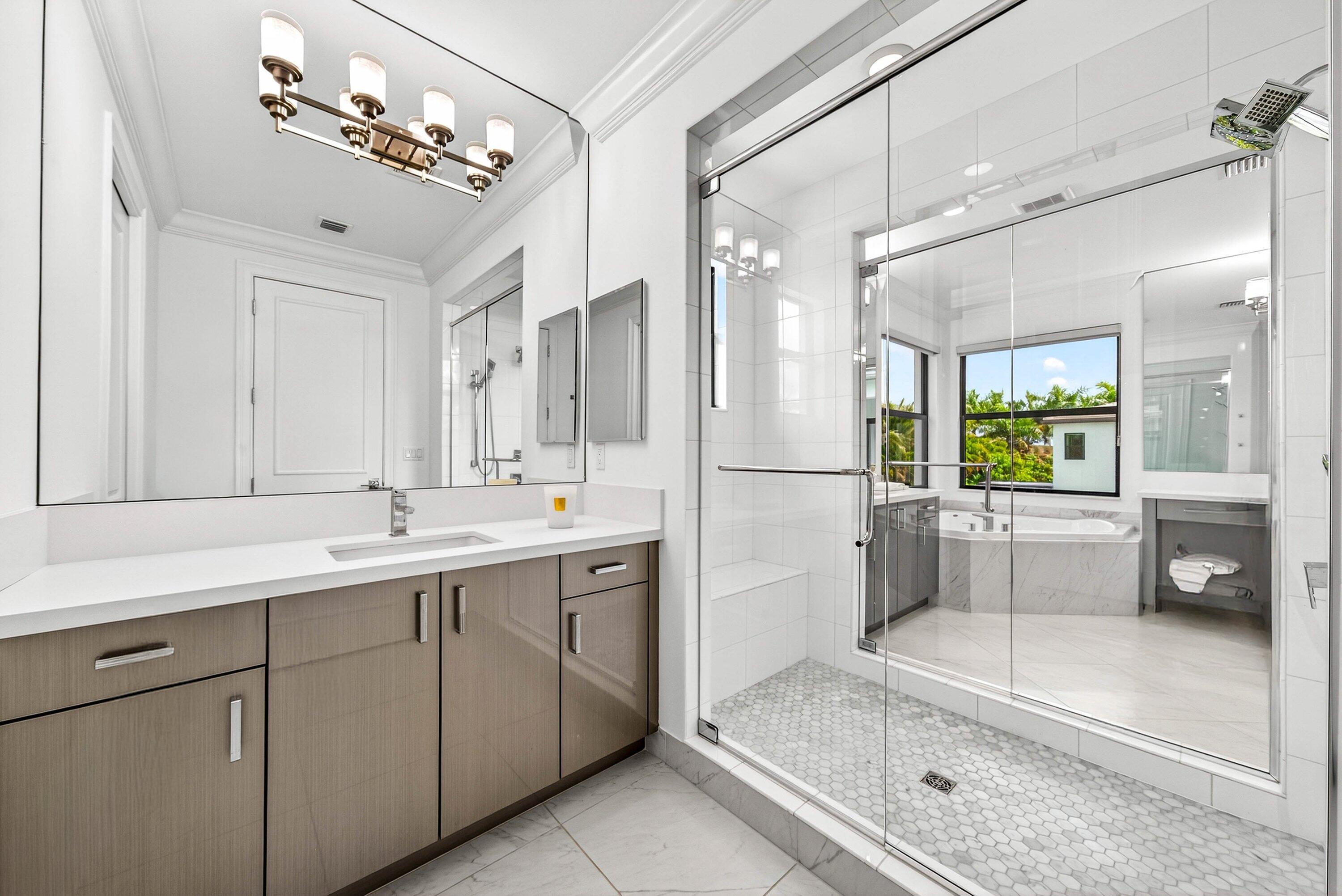9065 Benedetta Place Boca Raton, FL 33496 - Photo 21 of 51 a bathroom with a double vanity sink and mirror
