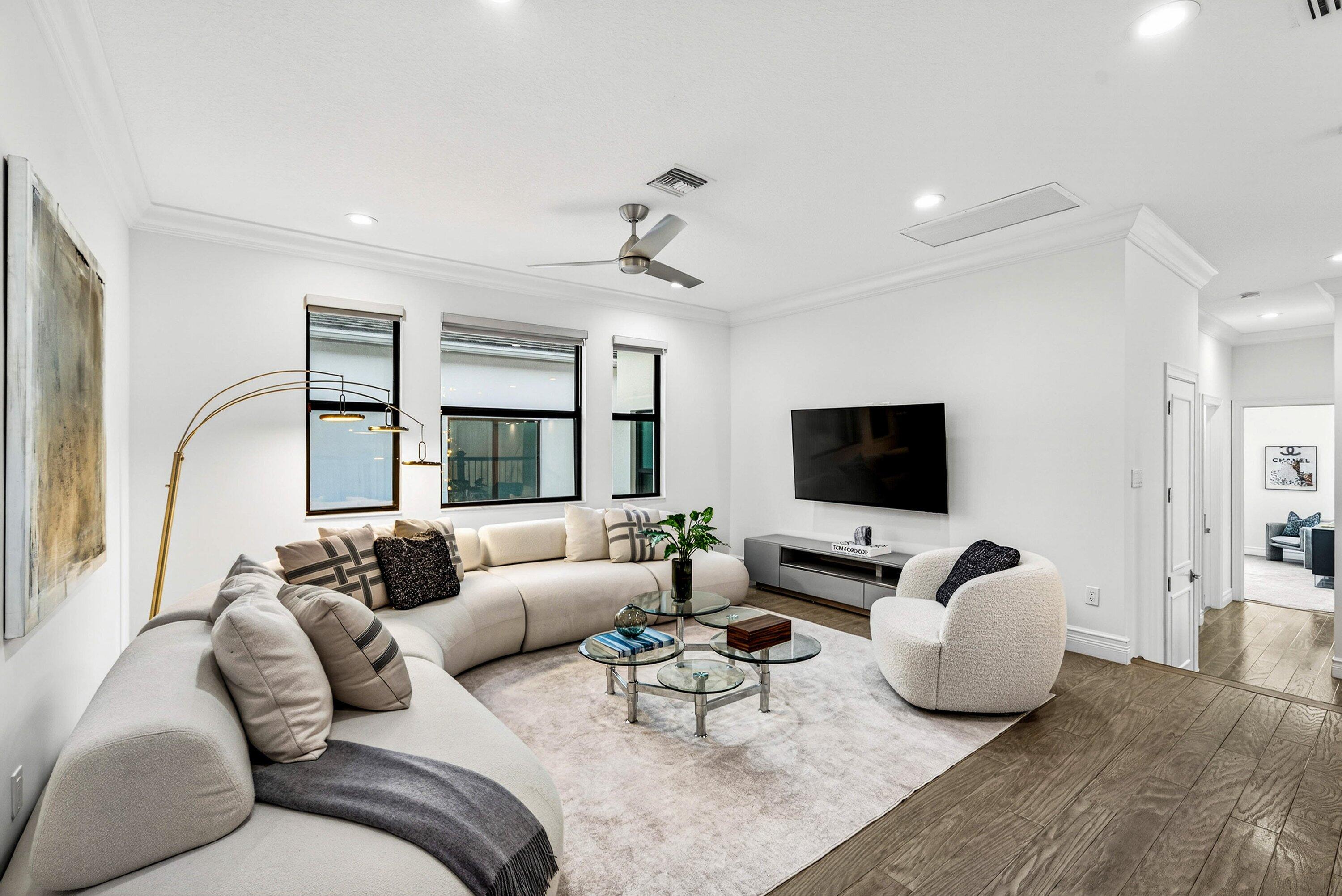 9065 Benedetta Place Boca Raton, FL 33496 - Photo 25 of 51 a living room with furniture flat screen tv and a large window