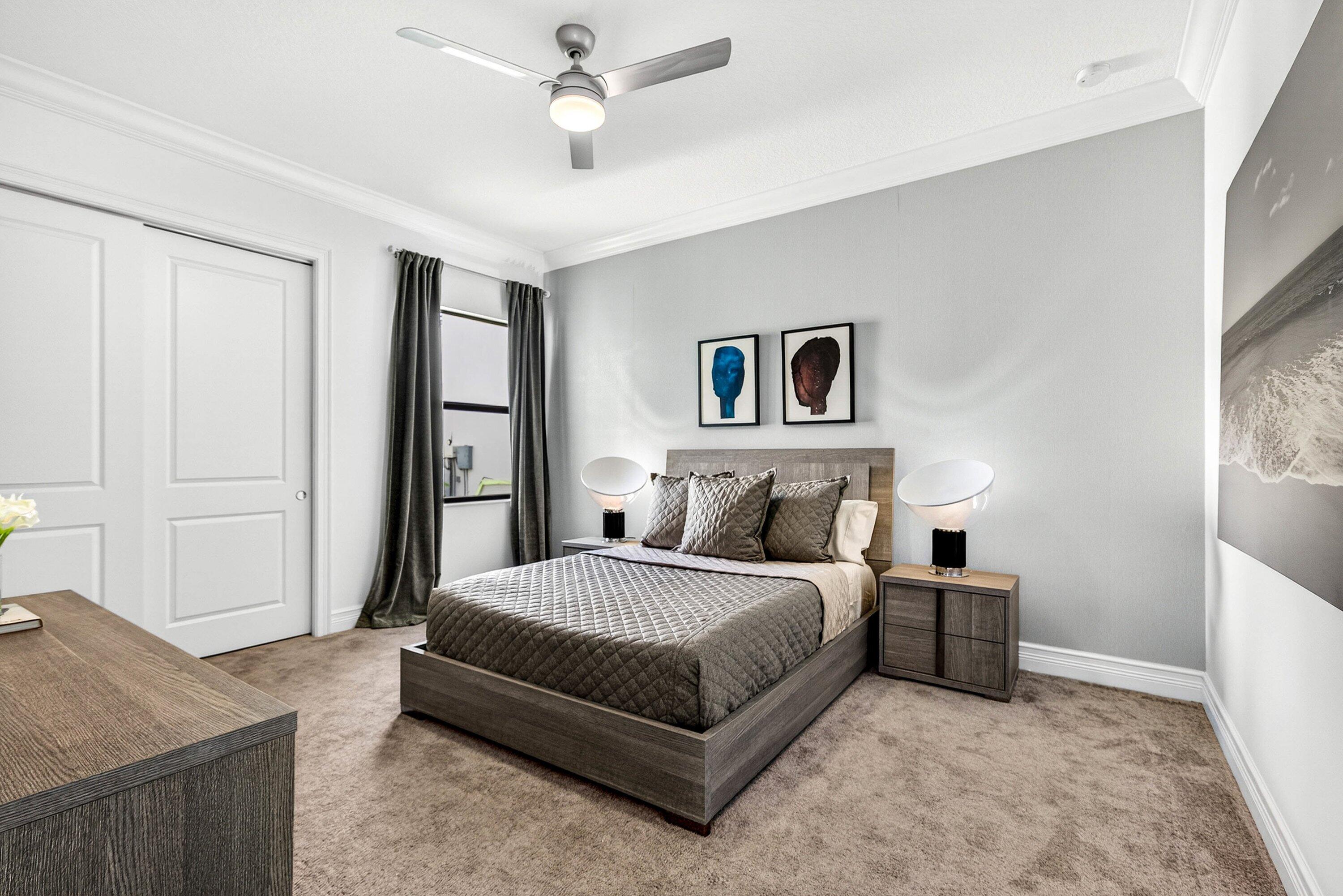 9065 Benedetta Place Boca Raton, FL 33496 - Photo 26 of 51 a bedroom with a bed and a chandelier