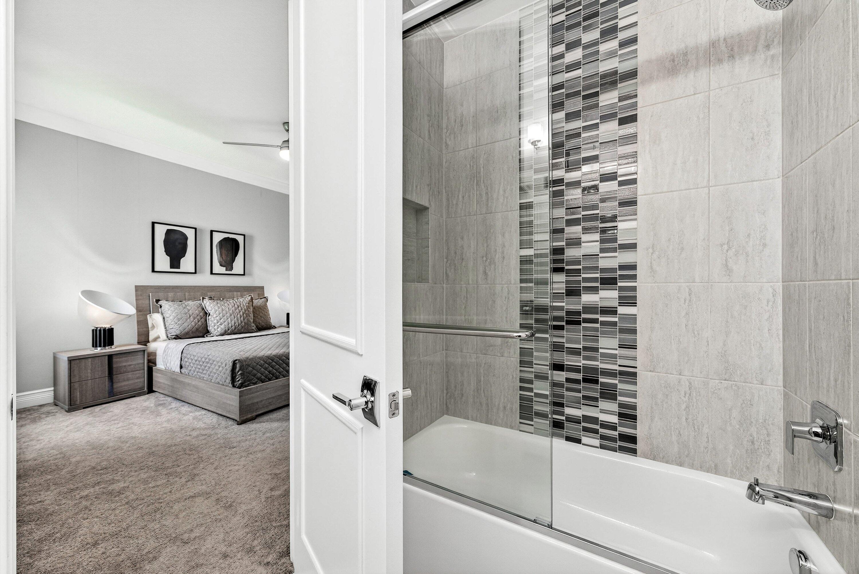 9065 Benedetta Place Boca Raton, FL 33496 - Photo 27 of 51 a bathroom with a bathtub and a shower