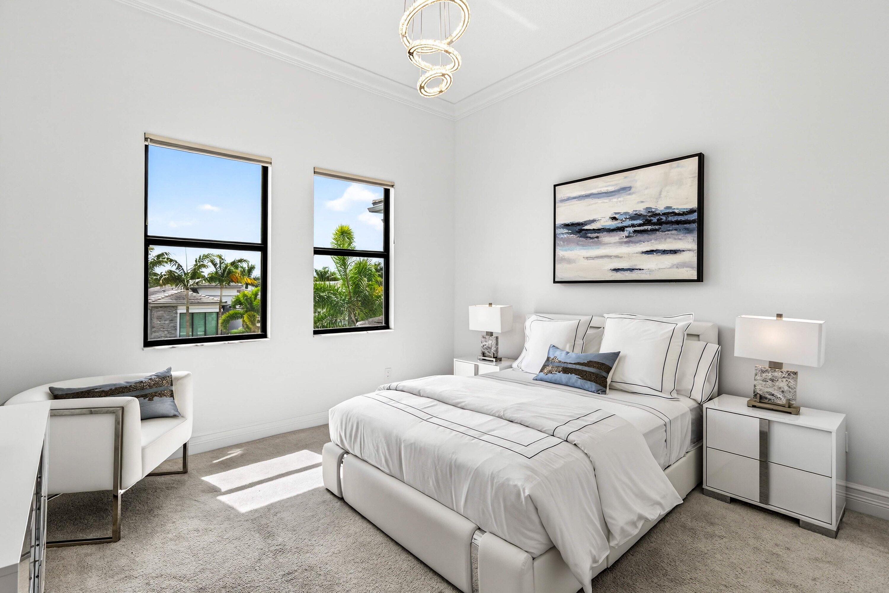 9065 Benedetta Place Boca Raton, FL 33496 - Photo 31 of 51 a bedroom with a bed and a painting on the wall