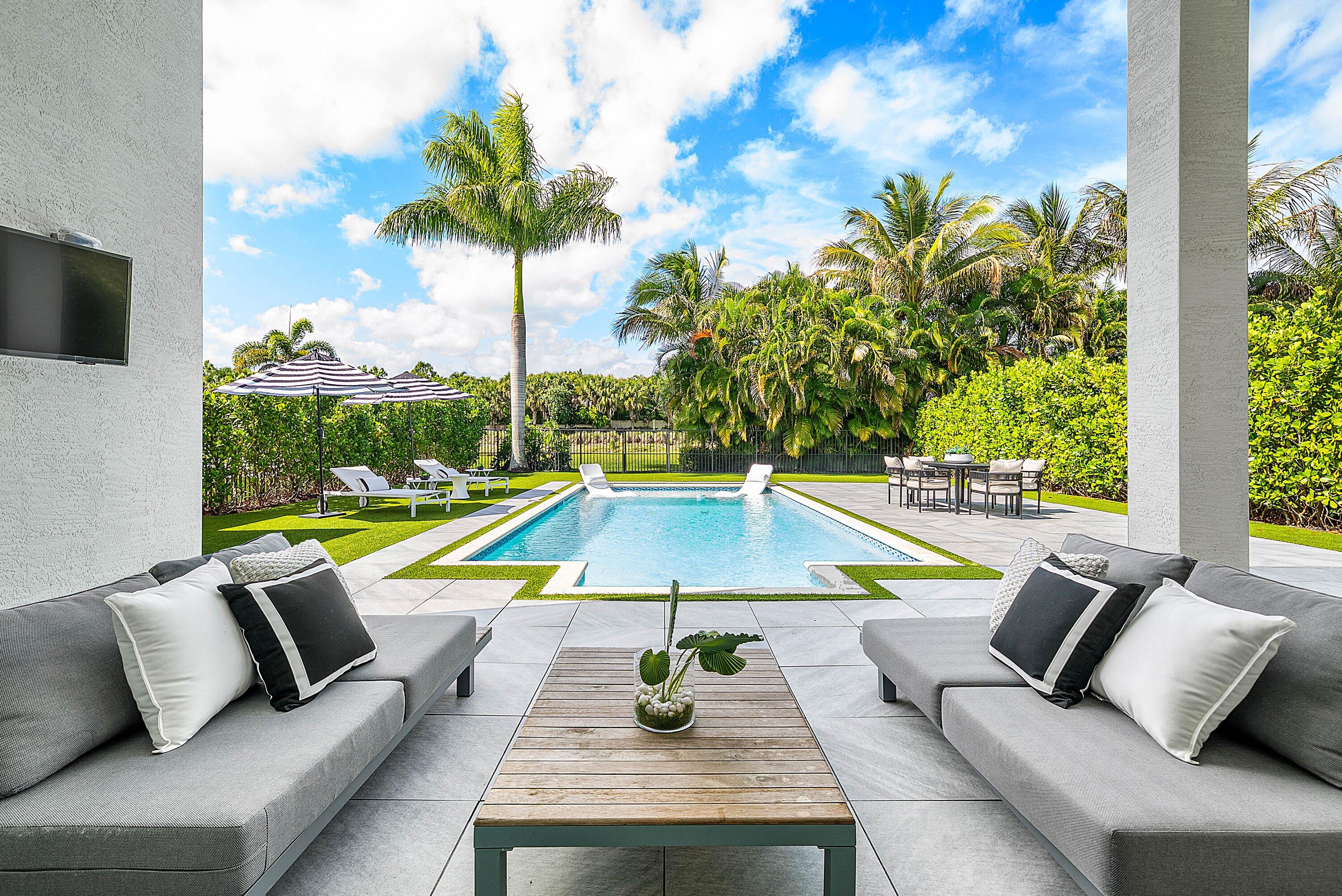 9065 Benedetta Place Boca Raton, FL 33496 - Photo 34 of 52 a view of swimming pool with lounge chair