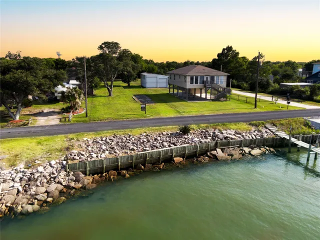 a view of a swimming pool with a yard