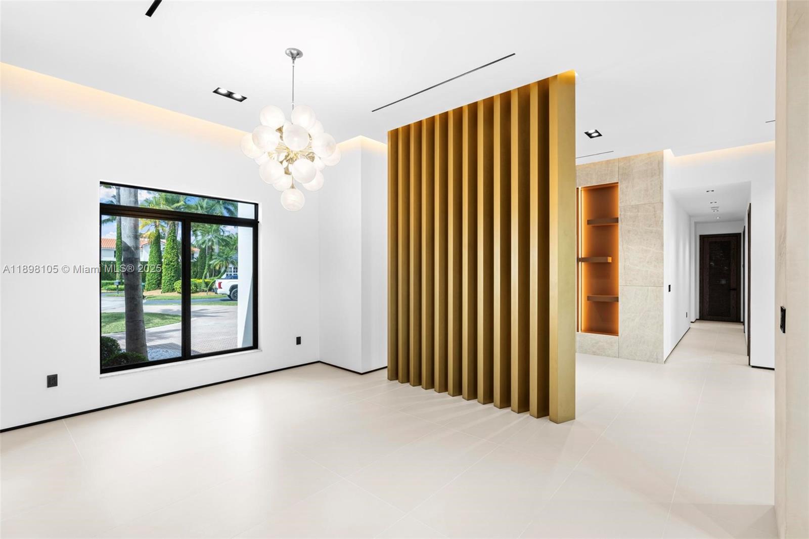 7755 Southwest 85th Court Miami, FL 33143 - Photo 12 of 70 a view of a big room with windows and chandelier