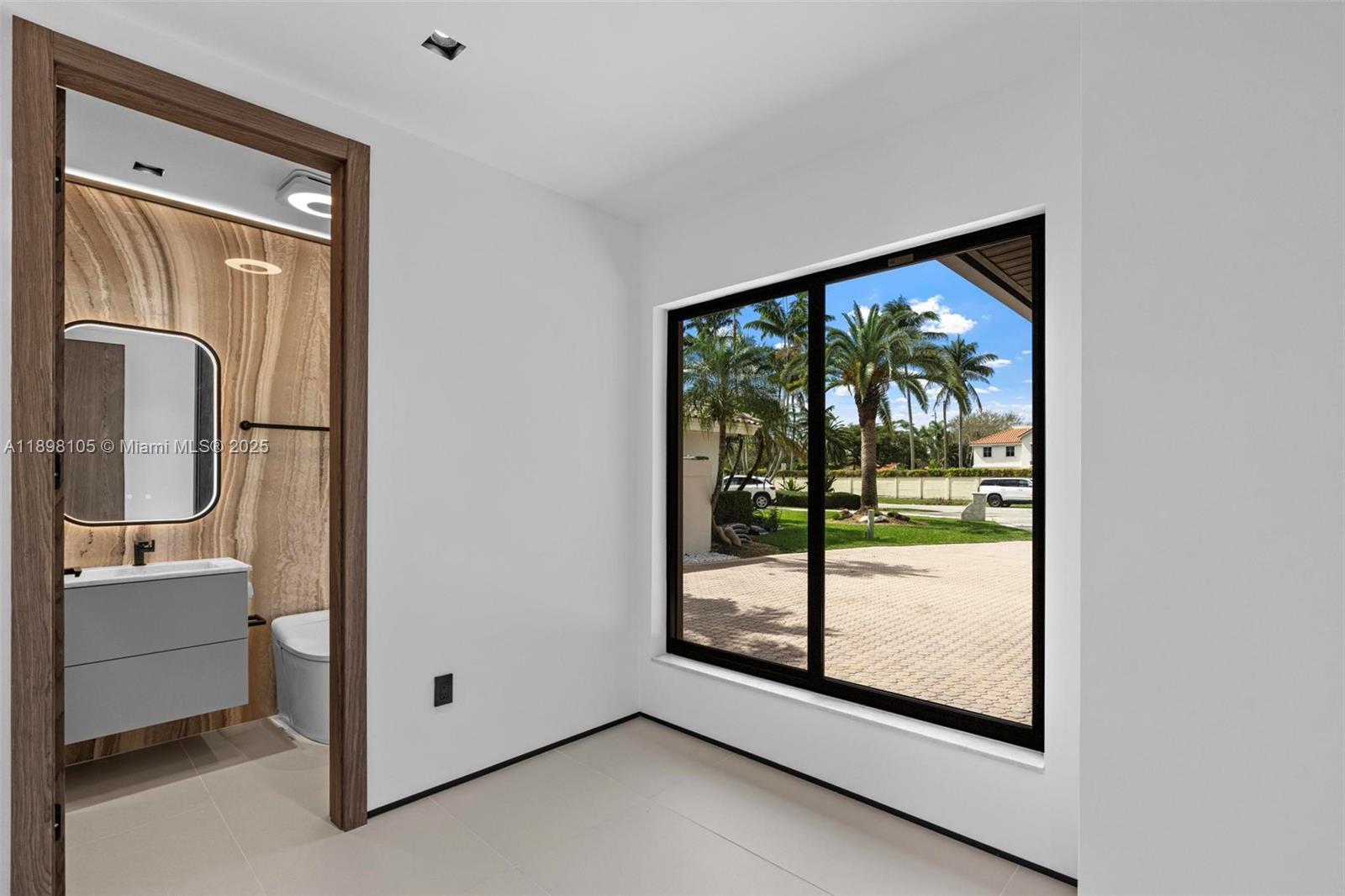 7755 Southwest 85th Court Miami, FL 33143 - Photo 42 of 70 a view of a room that has a large window