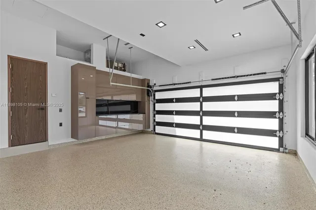 an aerial view of a house with backyard