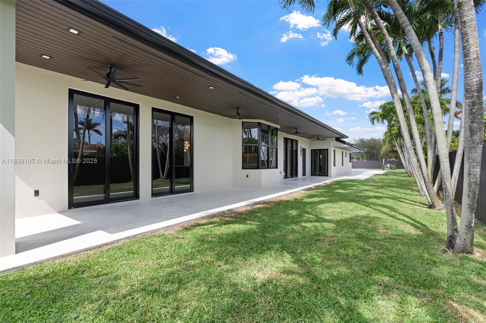 7755 Southwest 85th Court Miami, FL 33143 - Photo 49 of 70 a view of a house with a backyard