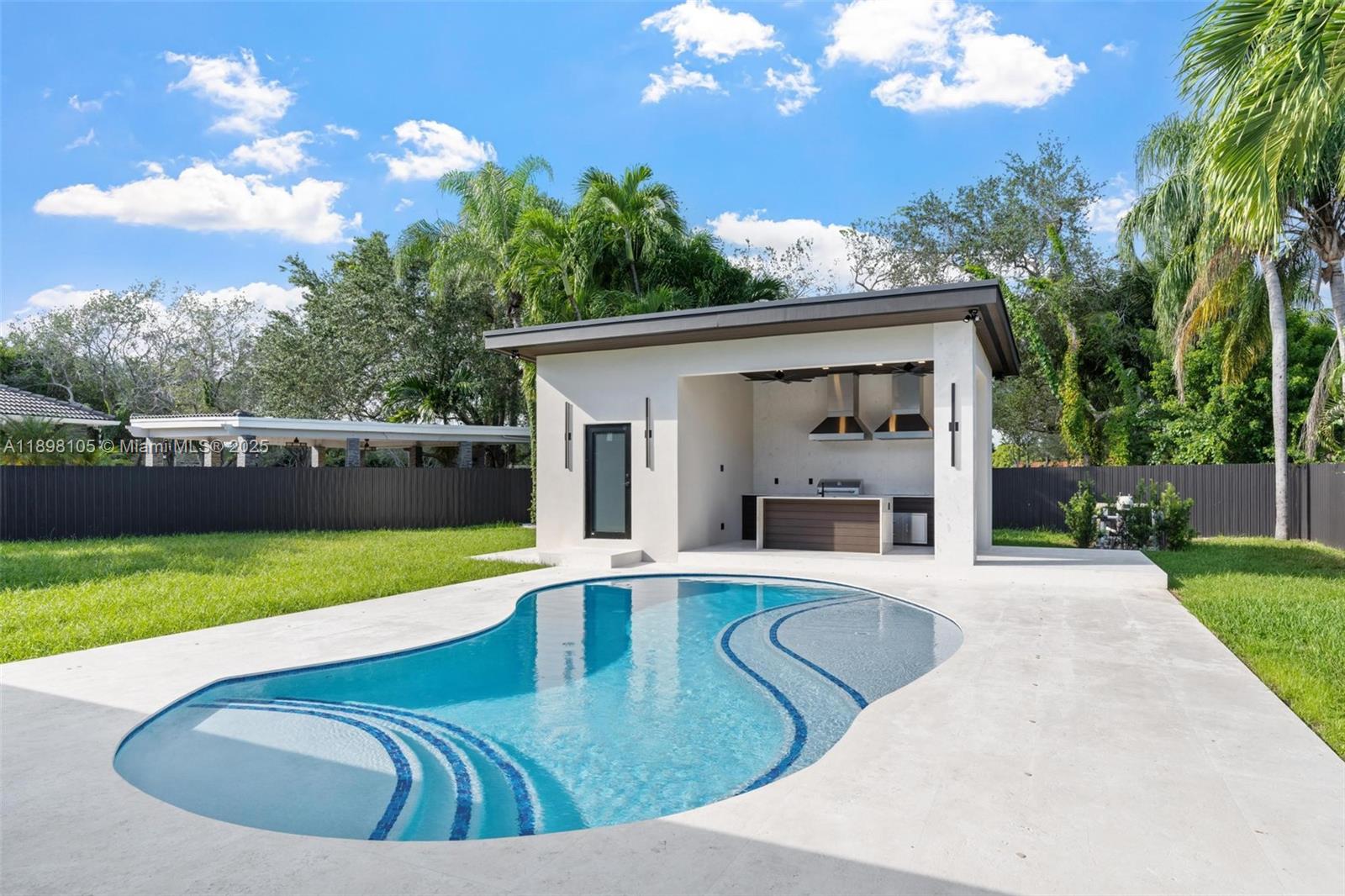 7755 Southwest 85th Court Miami, FL 33143 - Photo 55 of 70 a view of a house with a swimming pool