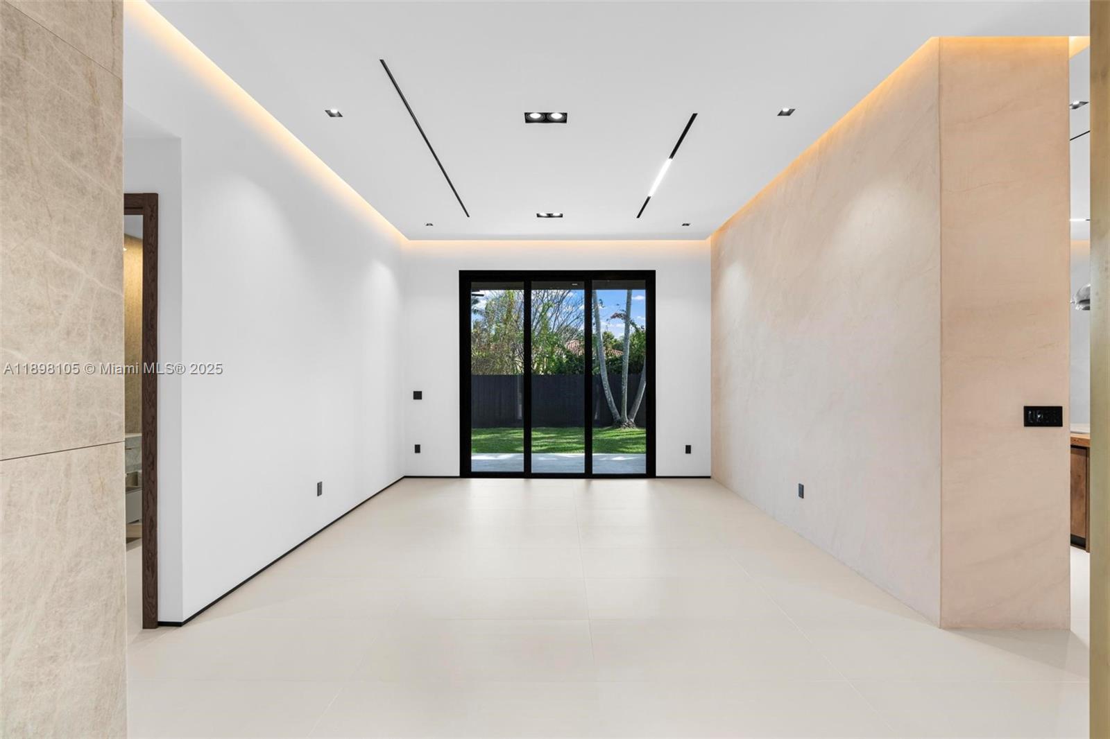 7755 Southwest 85th Court Miami, FL 33143 - Photo 8 of 70 a view of an empty room with a window