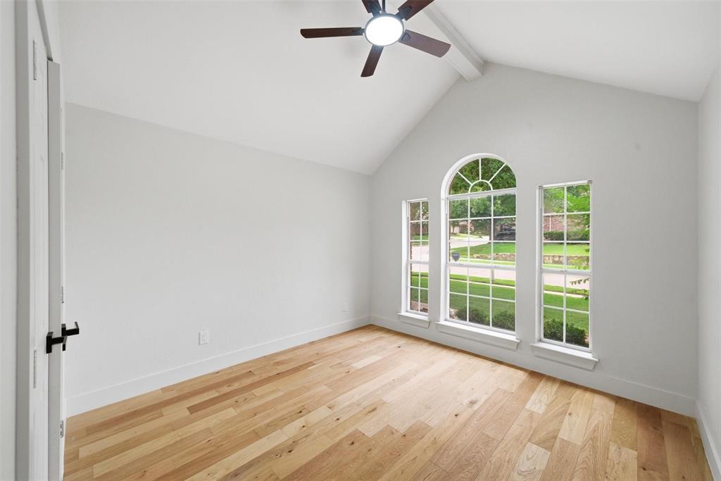 2104 Old McGarrah Road McKinney, TX 75072 - Photo 10 of 35 Vauted ceiling with exposed beam, wood-finish flooring, and arched window