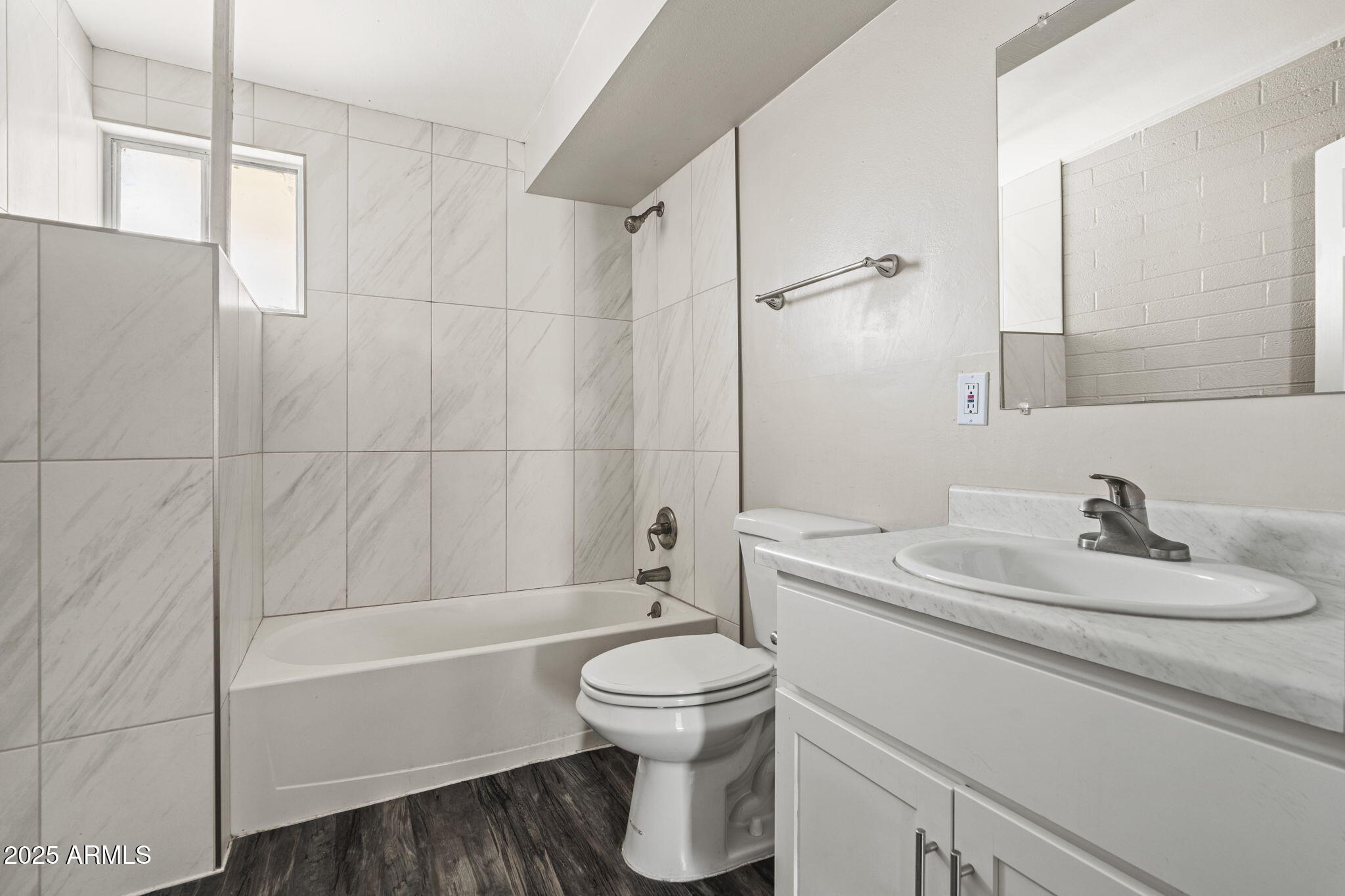 221 5th Avenue East, Unit 225 Buckeye, AZ 85326 - Photo 14 of 14 a bathroom with a sink toilet tub and shower