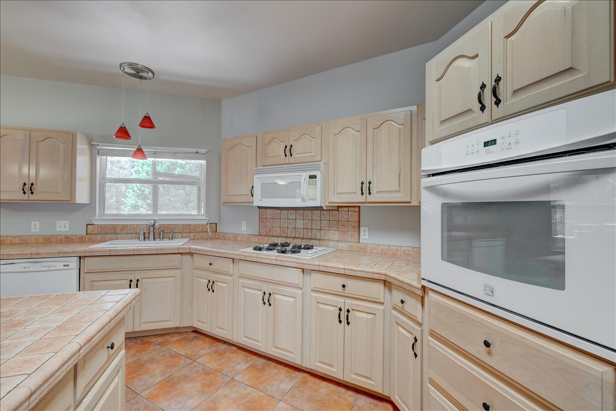 1818 Huntington Road Niceville, FL 32578 - Photo 16 of 53 a kitchen with cabinets appliances and a window