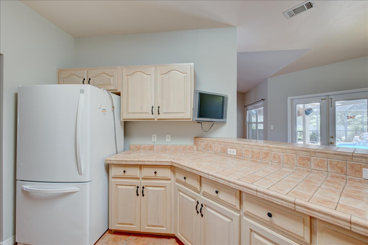 1818 Huntington Road Niceville, FL 32578 - Photo 17 of 53 a kitchen with white cabinets and white appliances