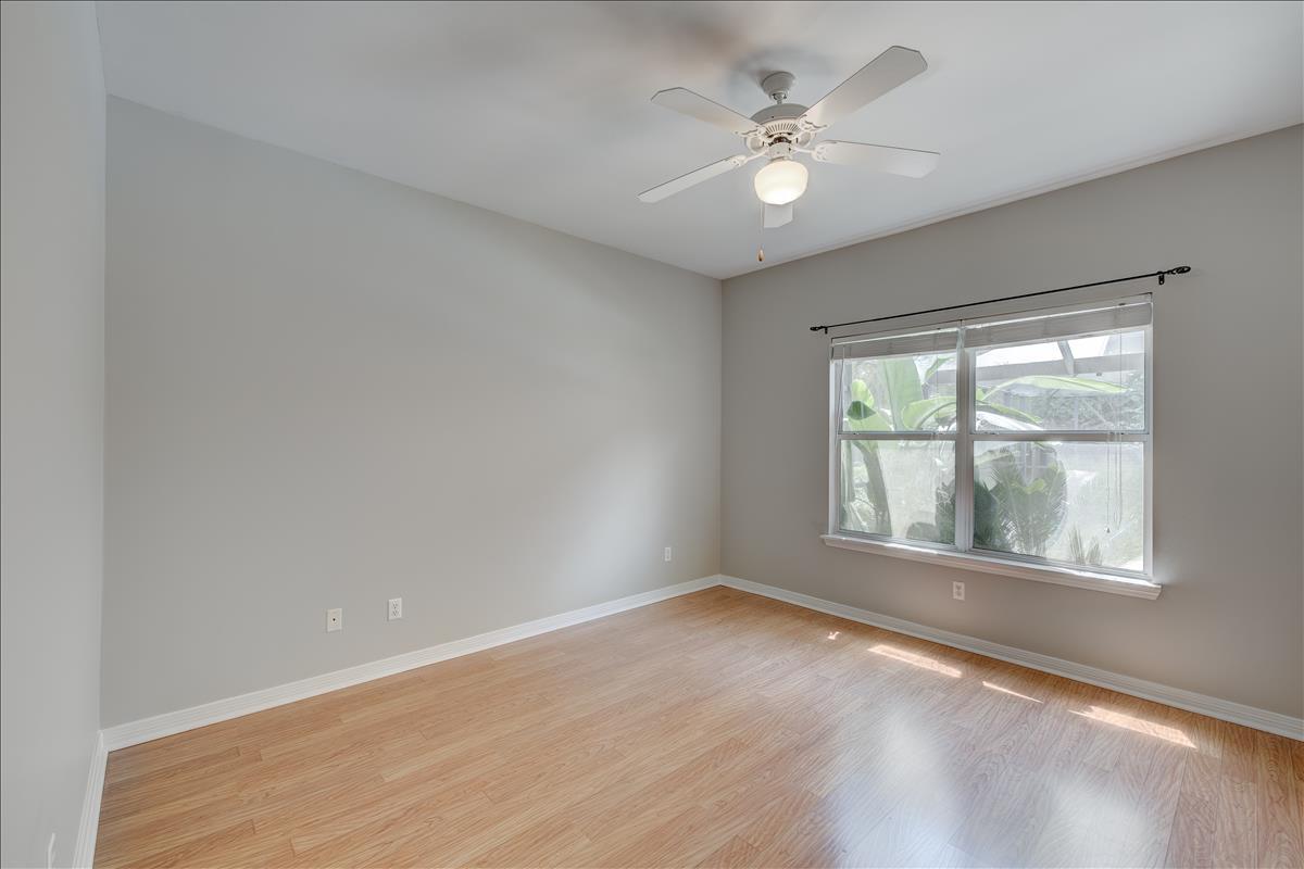 1818 Huntington Road Niceville, FL 32578 - Photo 20 of 53 an empty room with wooden floor and windows