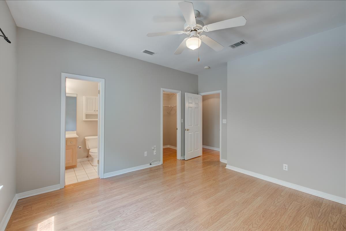 1818 Huntington Road Niceville, FL 32578 - Photo 21 of 53 an empty room with wooden floor and fan