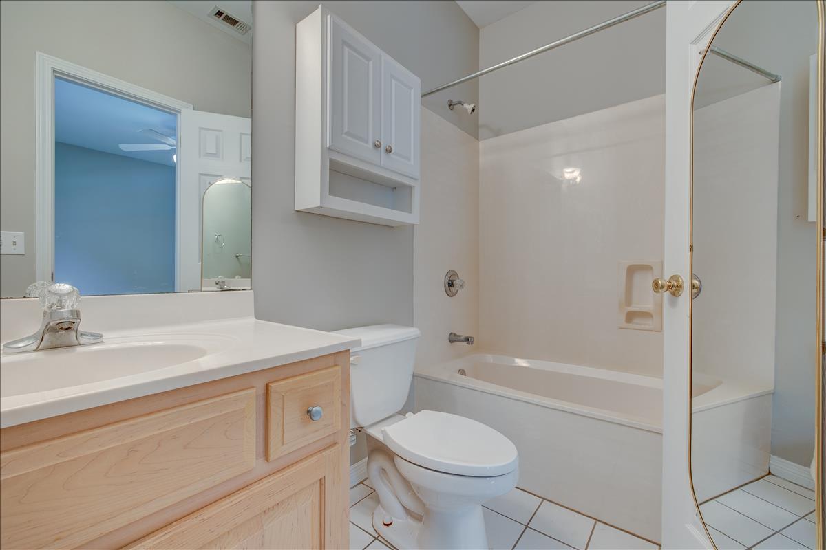 1818 Huntington Road Niceville, FL 32578 - Photo 22 of 53 a bathroom with a sink a toilet and shower