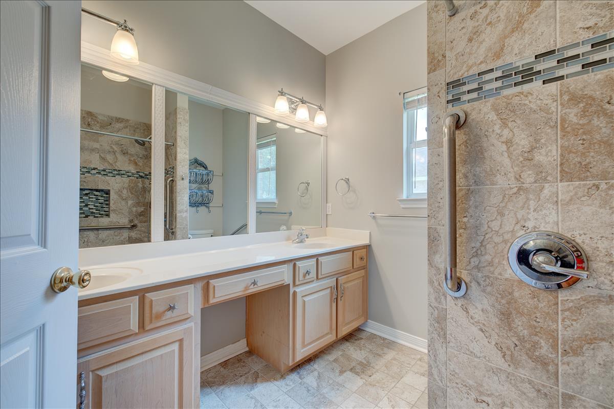 1818 Huntington Road Niceville, FL 32578 - Photo 26 of 53 a bathroom with a sink a vanity and a mirror