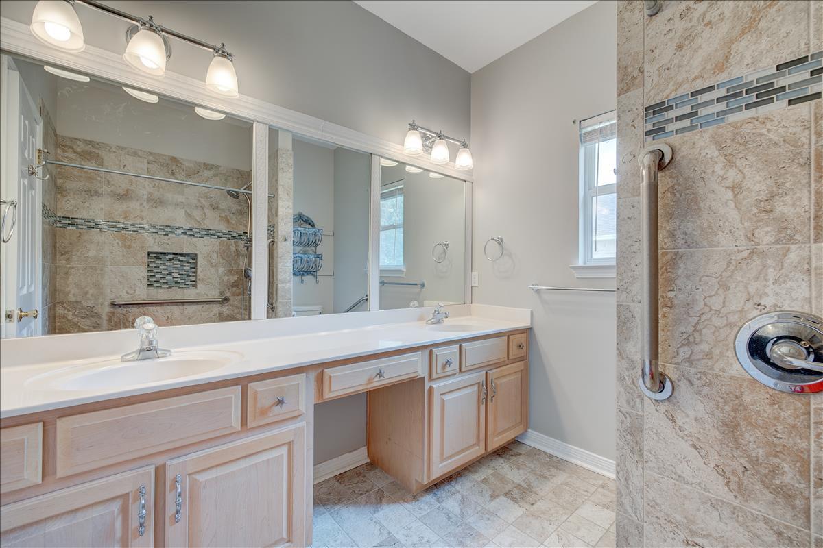 1818 Huntington Road Niceville, FL 32578 - Photo 27 of 53 a bathroom with a double vanity sink mirror and shower
