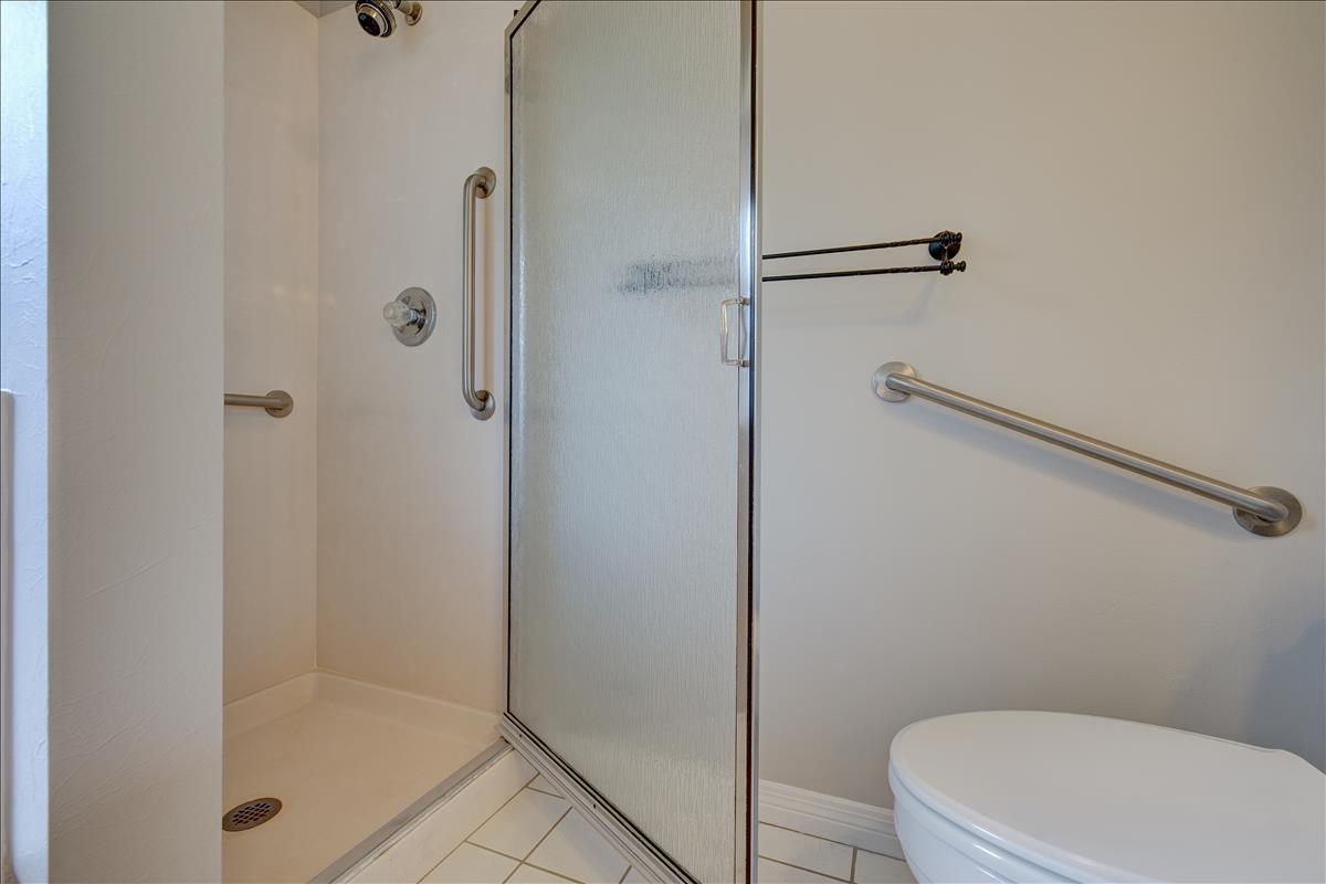 1818 Huntington Road Niceville, FL 32578 - Photo 37 of 53 a white toilet sitting next to a bathroom sink