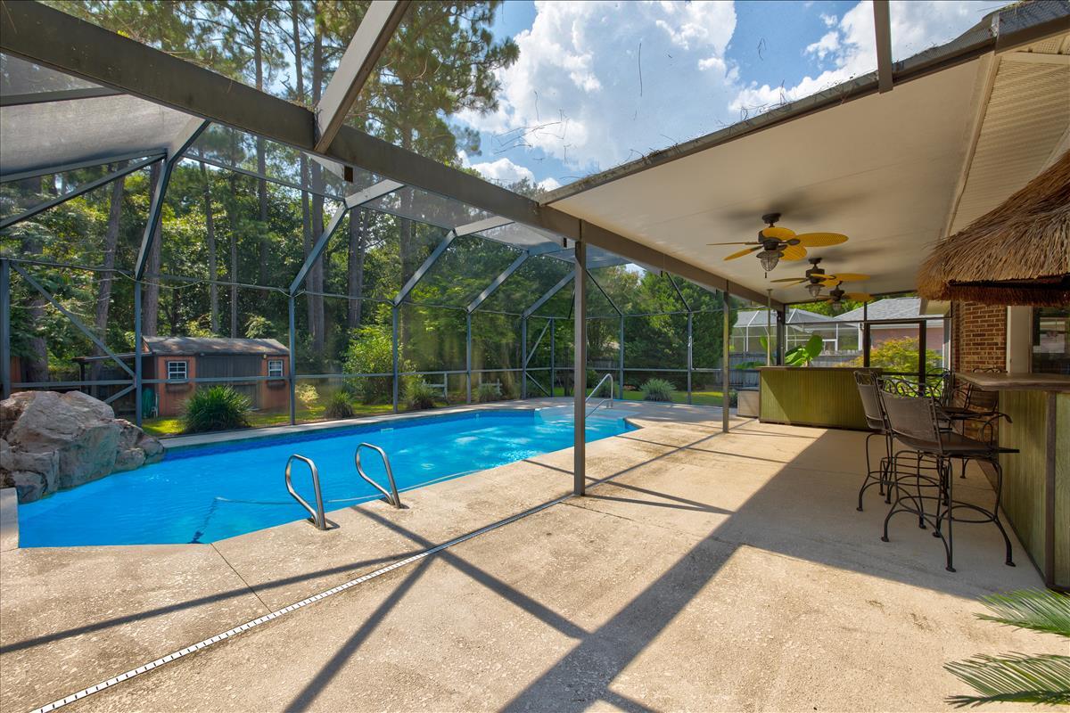1818 Huntington Road Niceville, FL 32578 - Photo 43 of 53 a view of a patio with a table and chairs