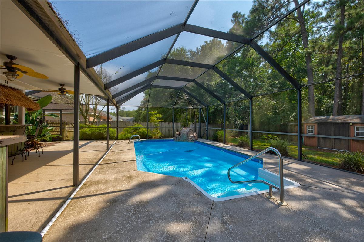 1818 Huntington Road Niceville, FL 32578 - Photo 44 of 53 a view of a backyard with a patio