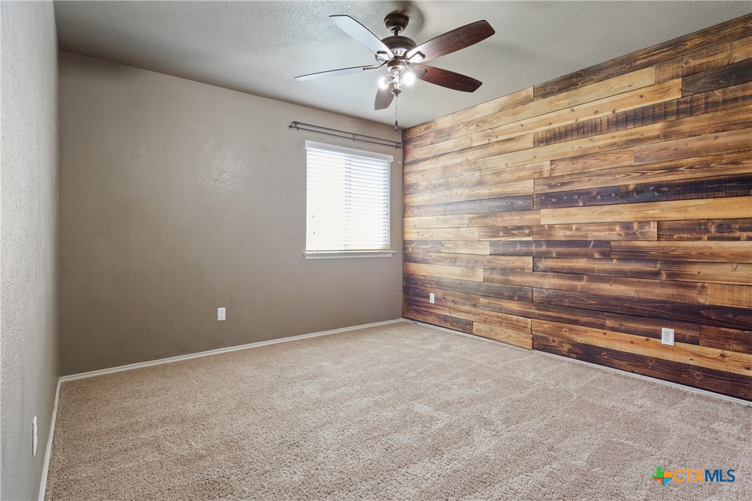 231 Druse Lane Jarrell, TX 76537 - Photo 25 of 38 a view of room with window and ceiling fan