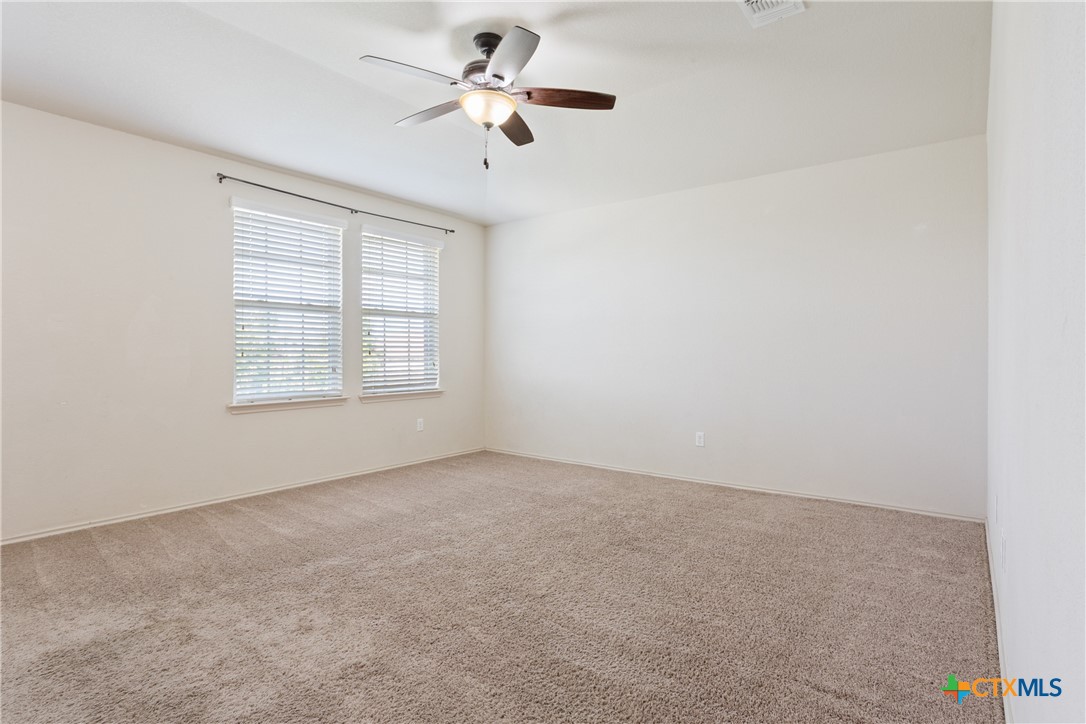 231 Druse Lane Jarrell, TX 76537 - Photo 29 of 38 an empty room with windows and fan