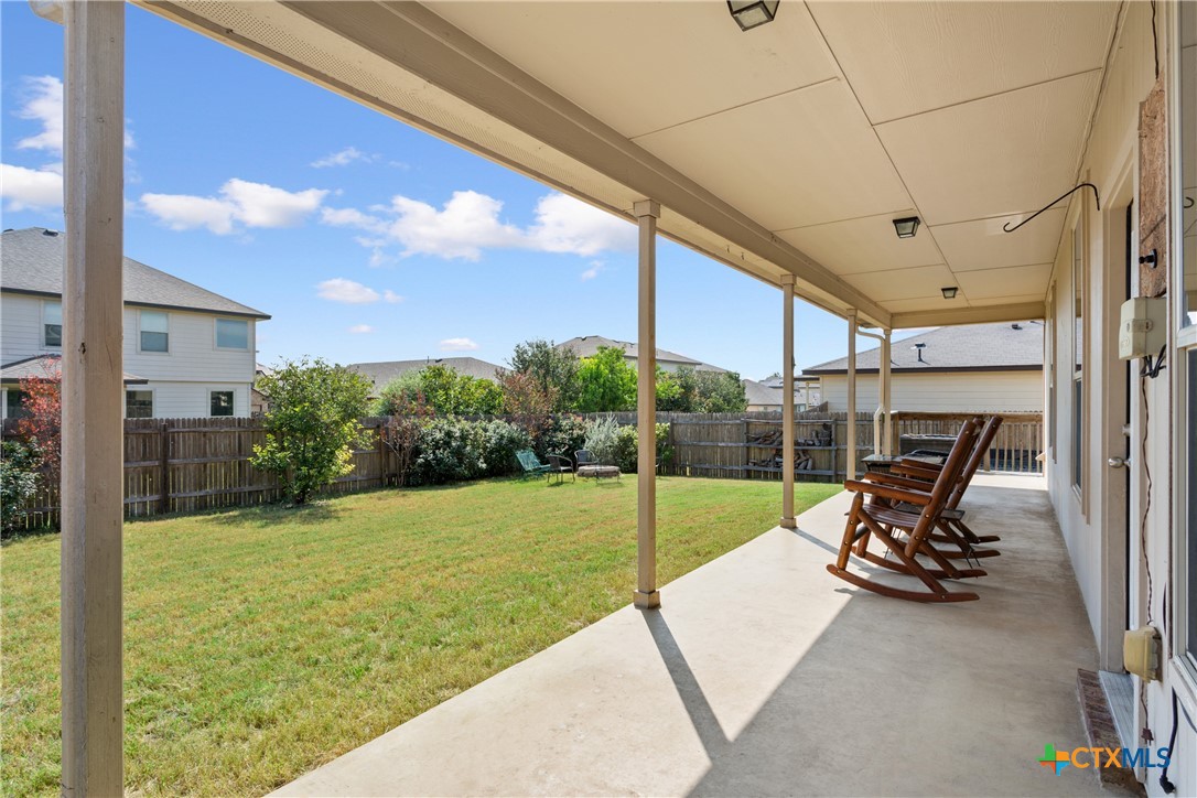 231 Druse Lane Jarrell, TX 76537 - Photo 37 of 38 a view of a chair and table in backyard of a house
