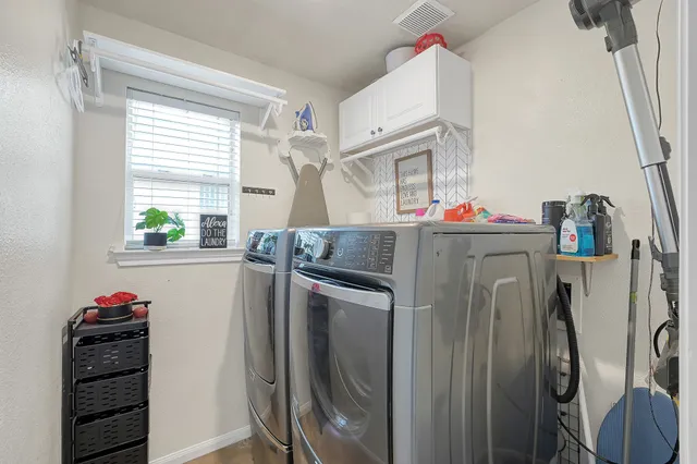 a utility room with closet dryer and washer