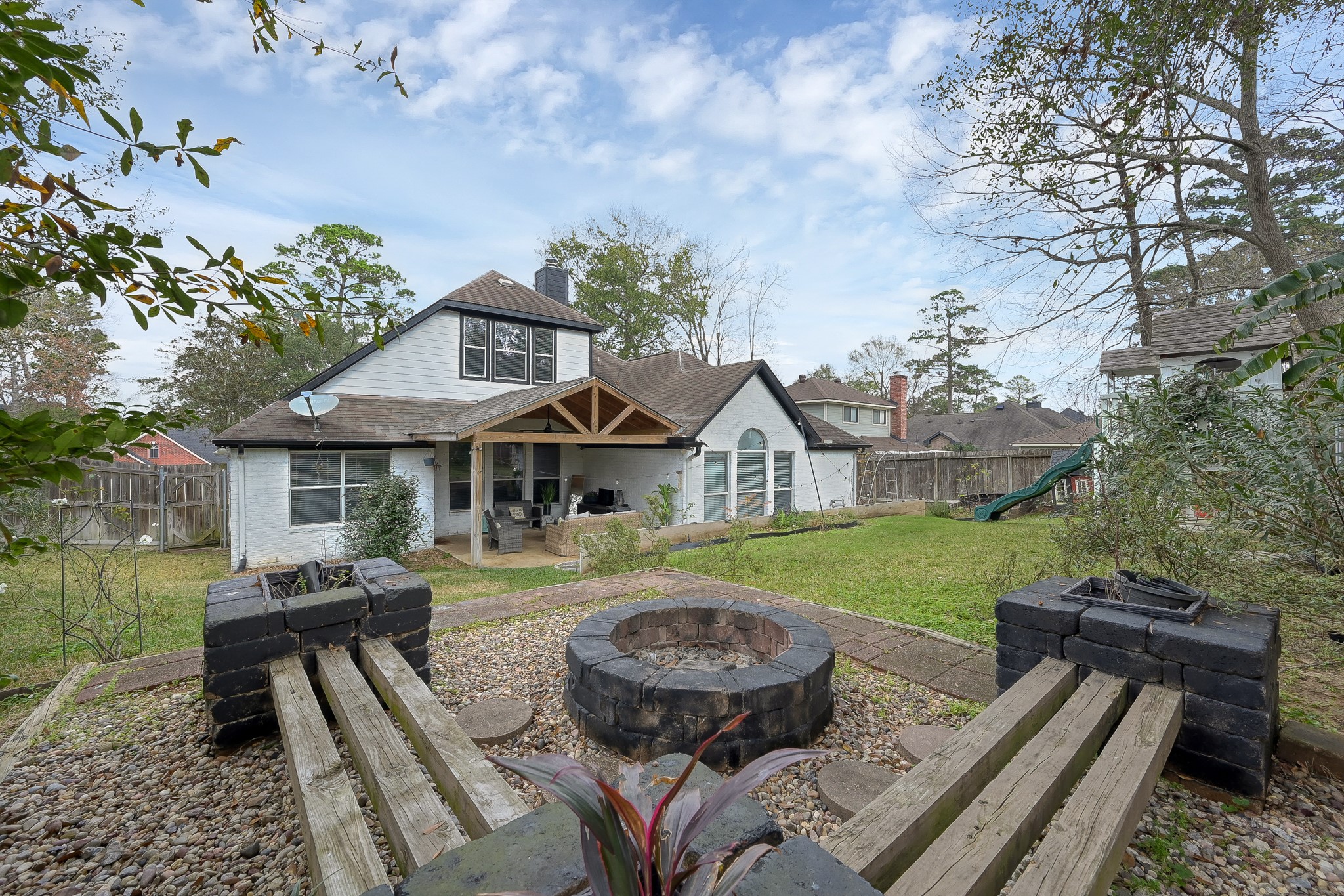 180 Park Way Conroe, TX 77356 - Photo 23 of 23 a view of a house with backyard and sitting area