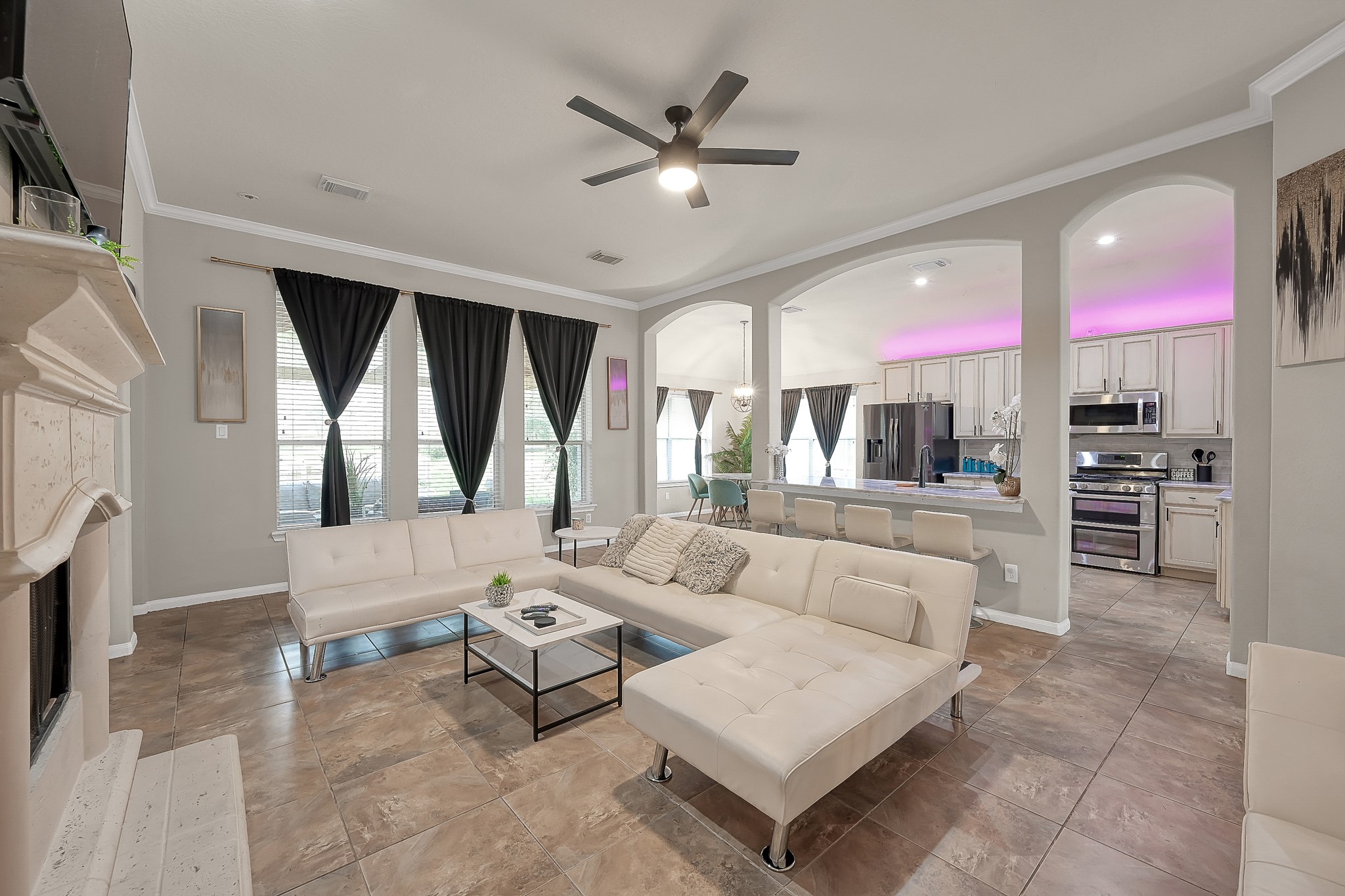 180 Park Way Conroe, TX 77356 - Photo 7 of 23 a living room with furniture a large window and a chandelier