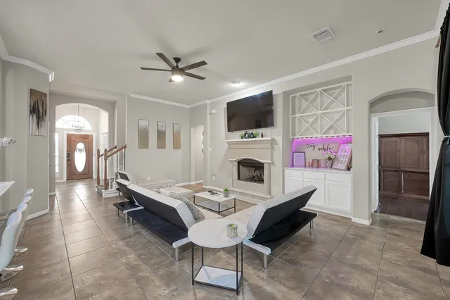 a living room with furniture and a fireplace